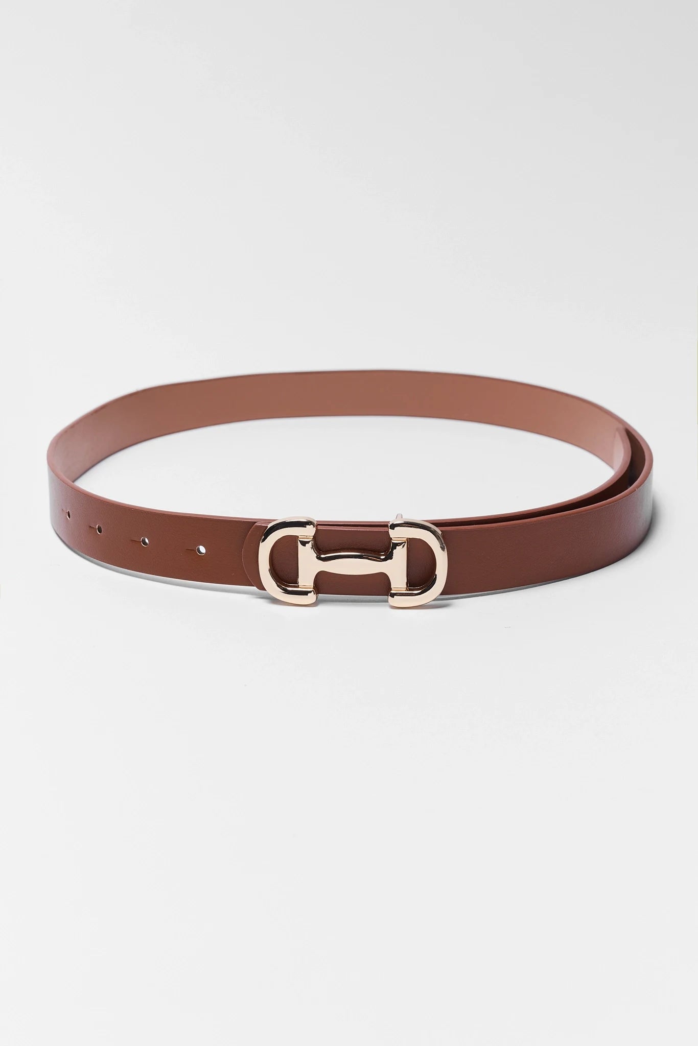 Brown belt with a gold buckle on a white background