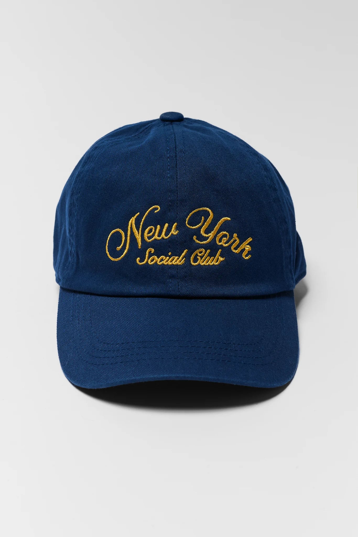 Blue cap with 'New York Social Club' text on a white background