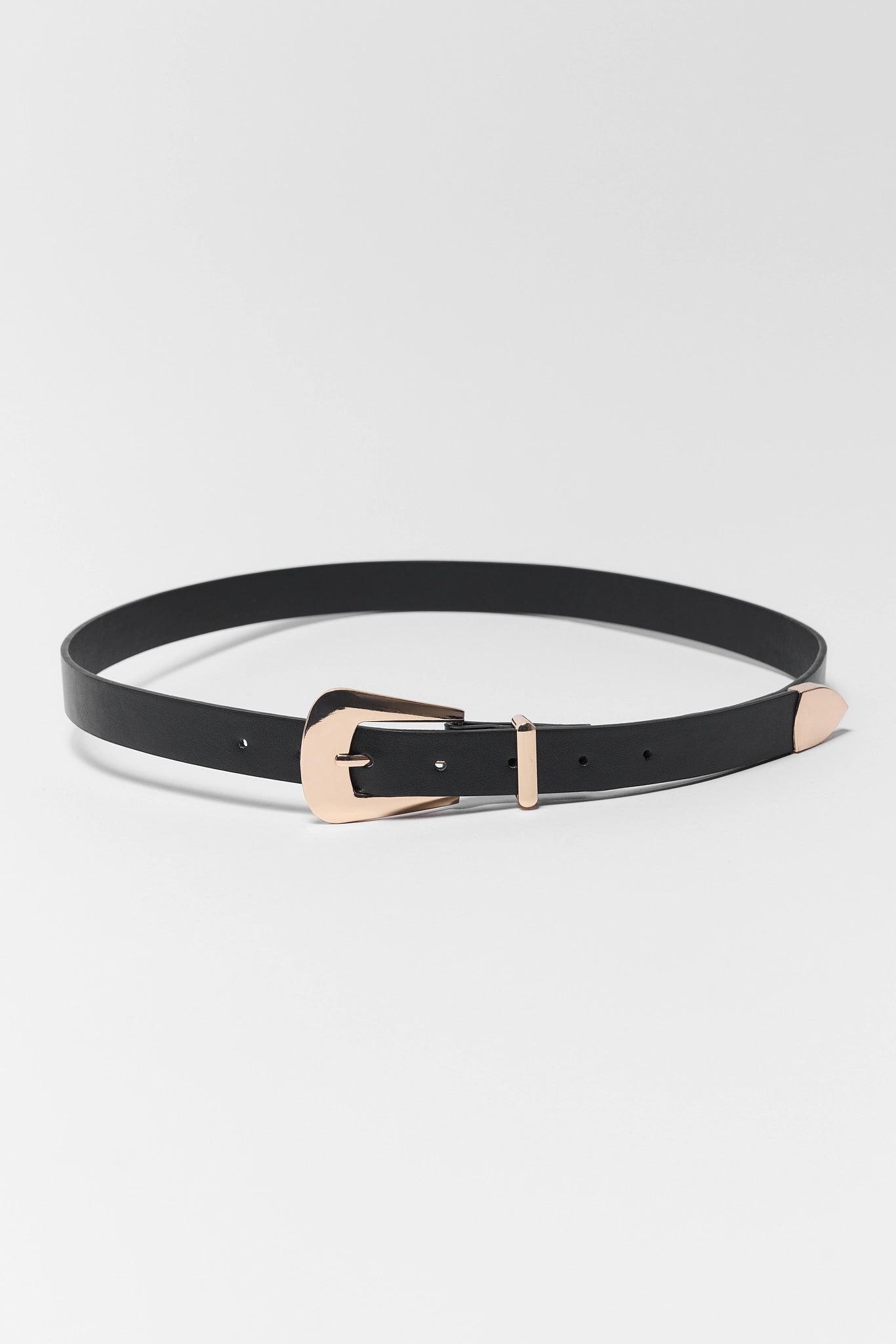 Black belt with a rose gold buckle on a light gray background