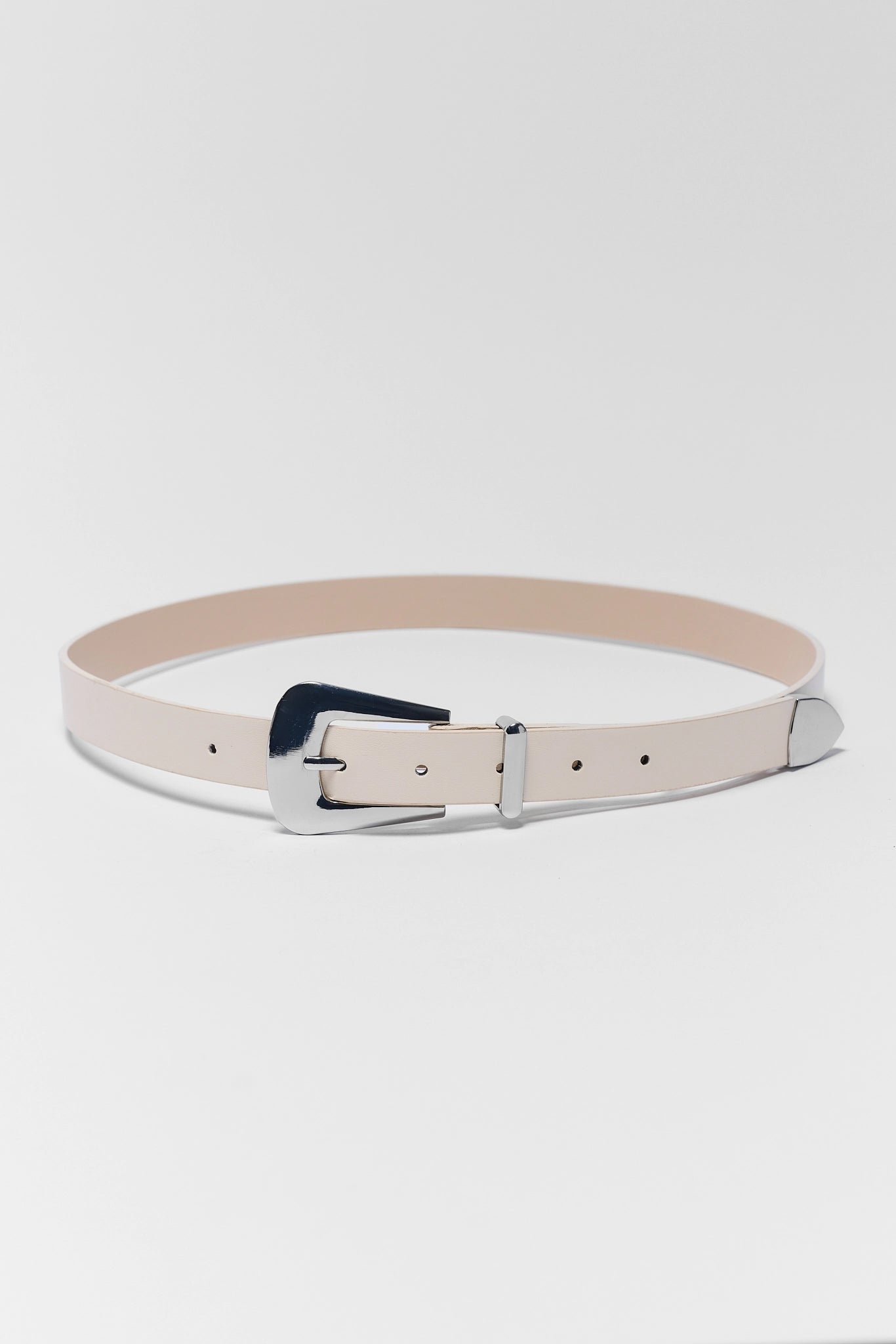 Beige belt with a silver buckle on a white background