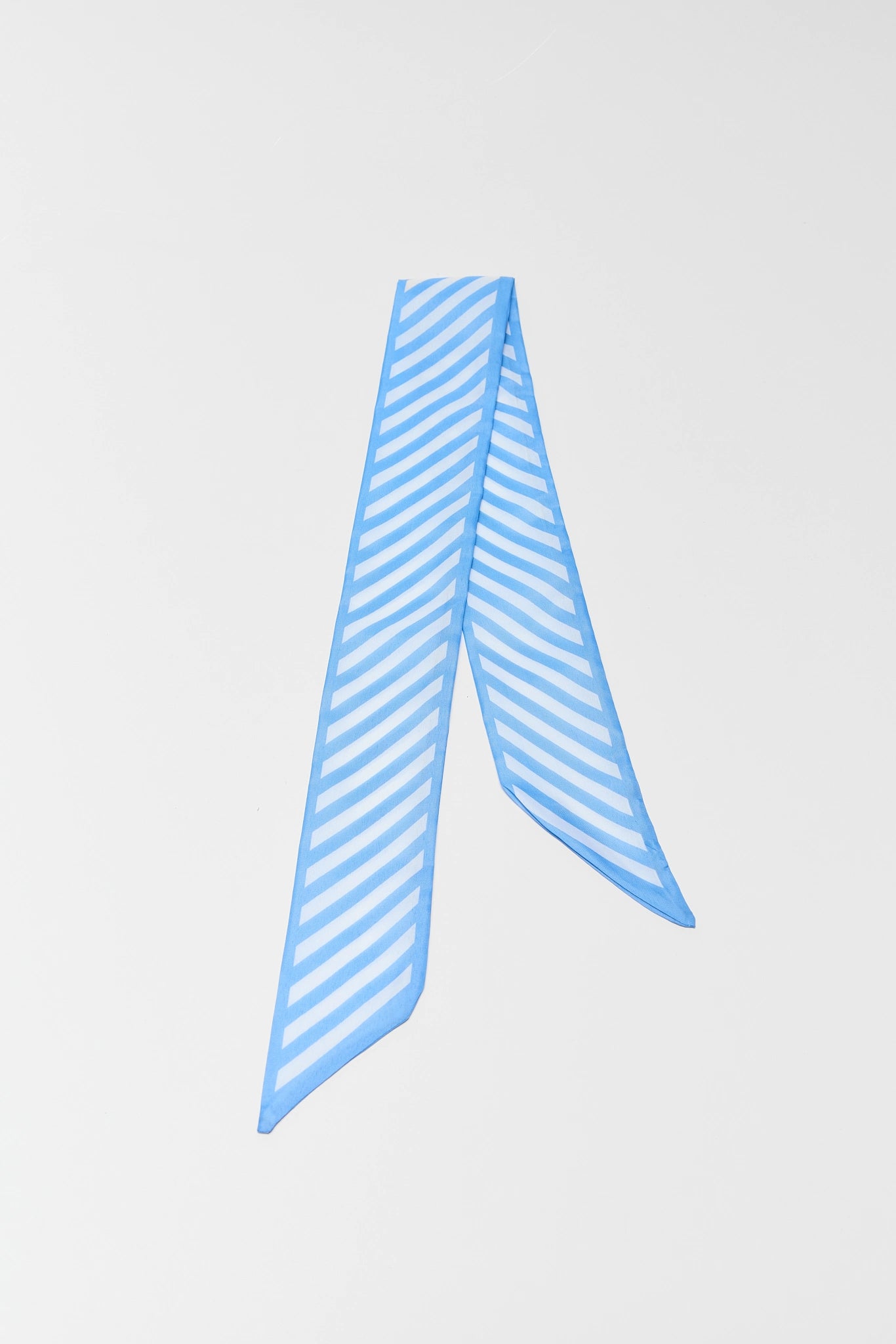 Blue striped scarf on a light gray background