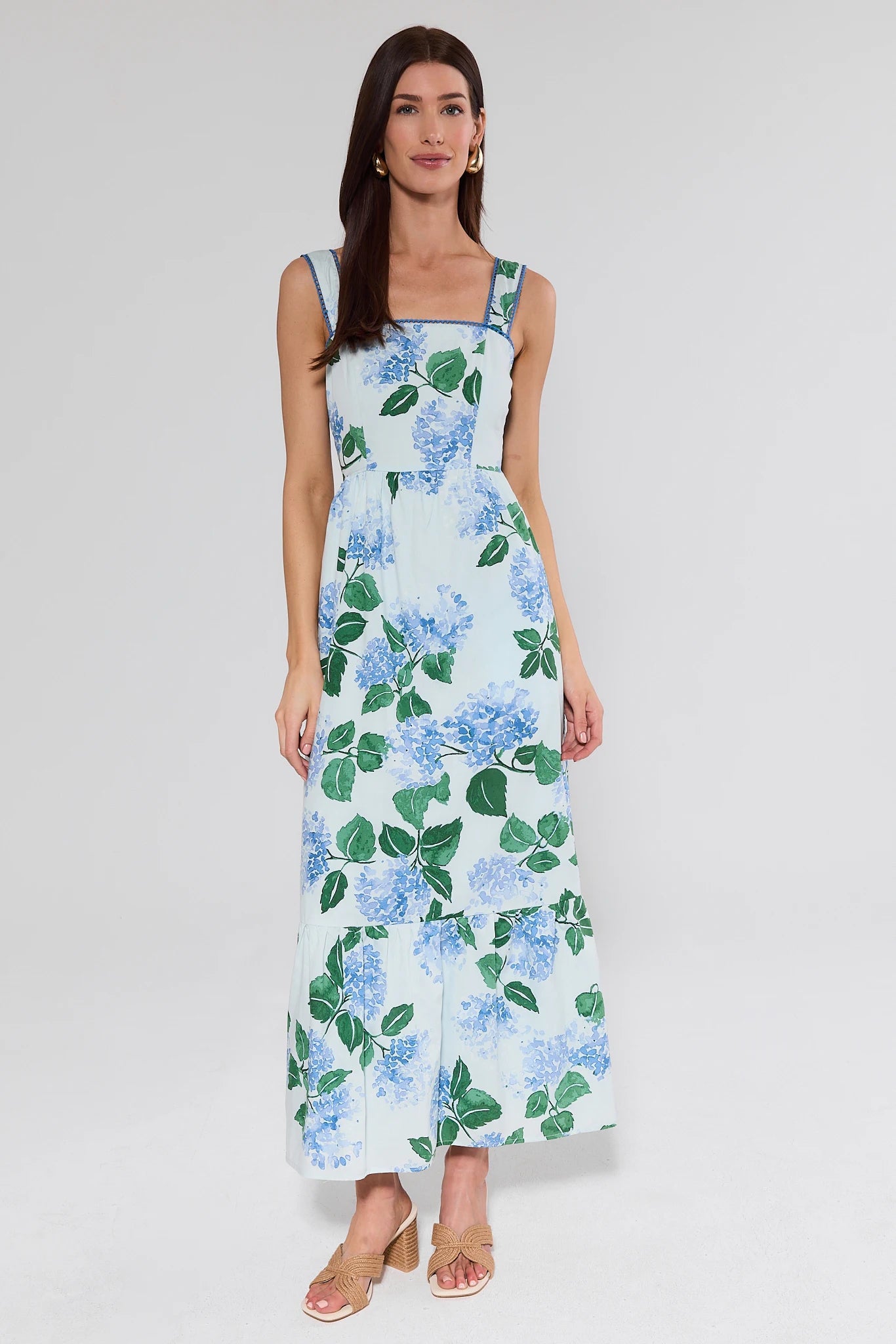 Woman wearing a floral dress on a white background