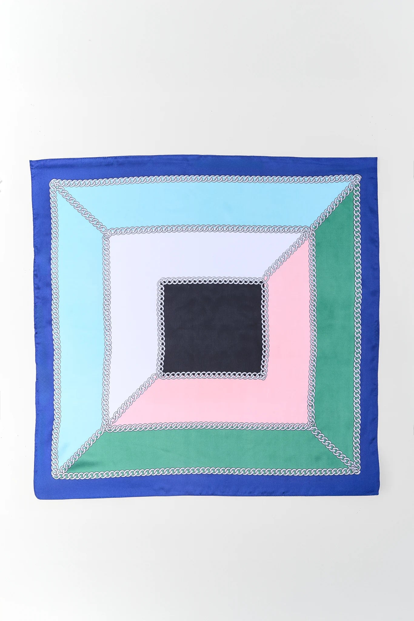 Colorful square patchwork quilt on a white background