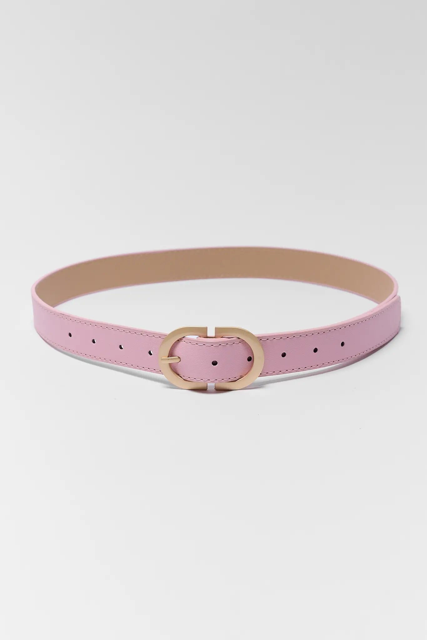 Pink belt with a gold buckle on a white background