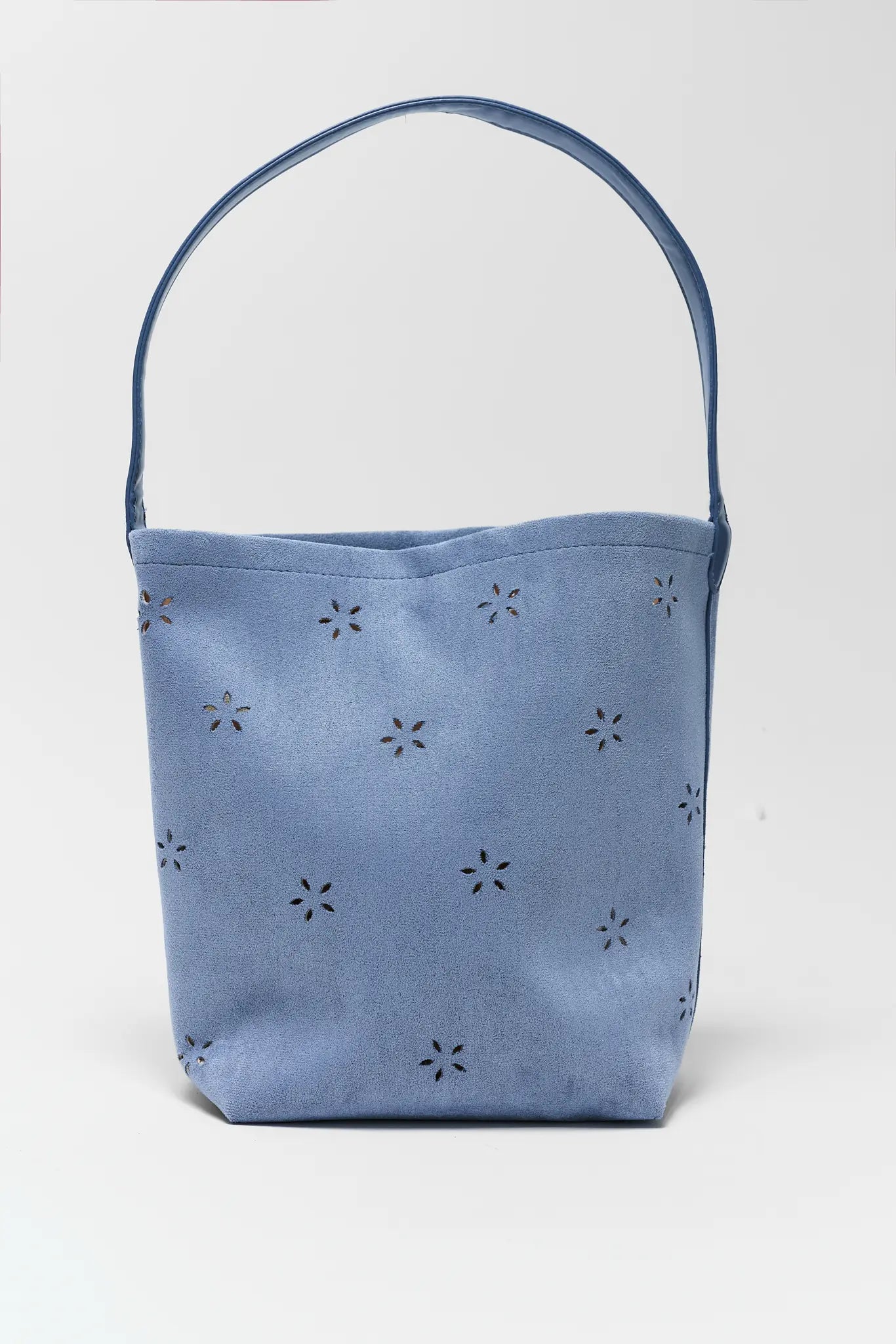 Blue bucket bag with floral patterns on a white background
