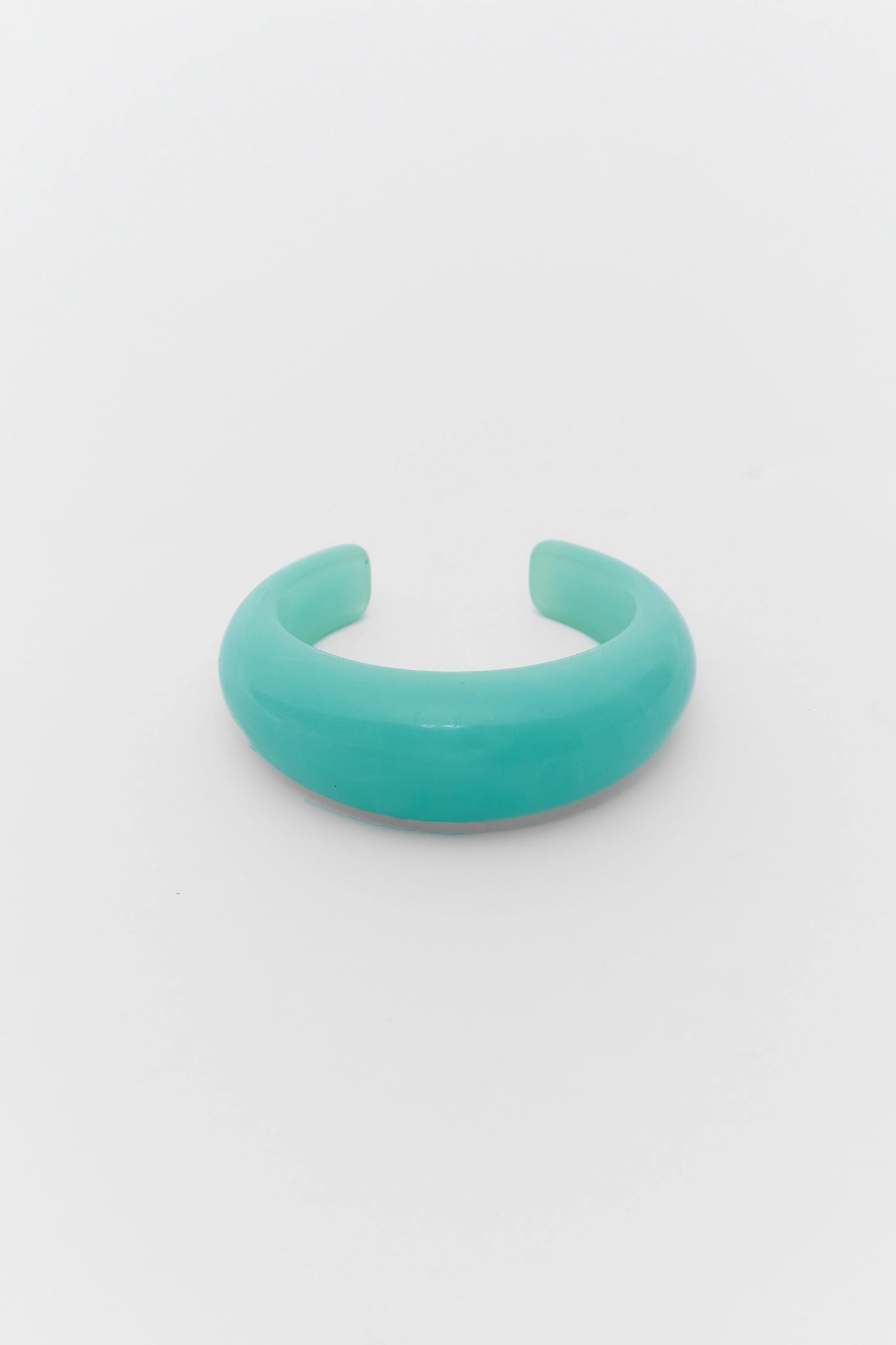 Turquoise bracelet on a light gray background