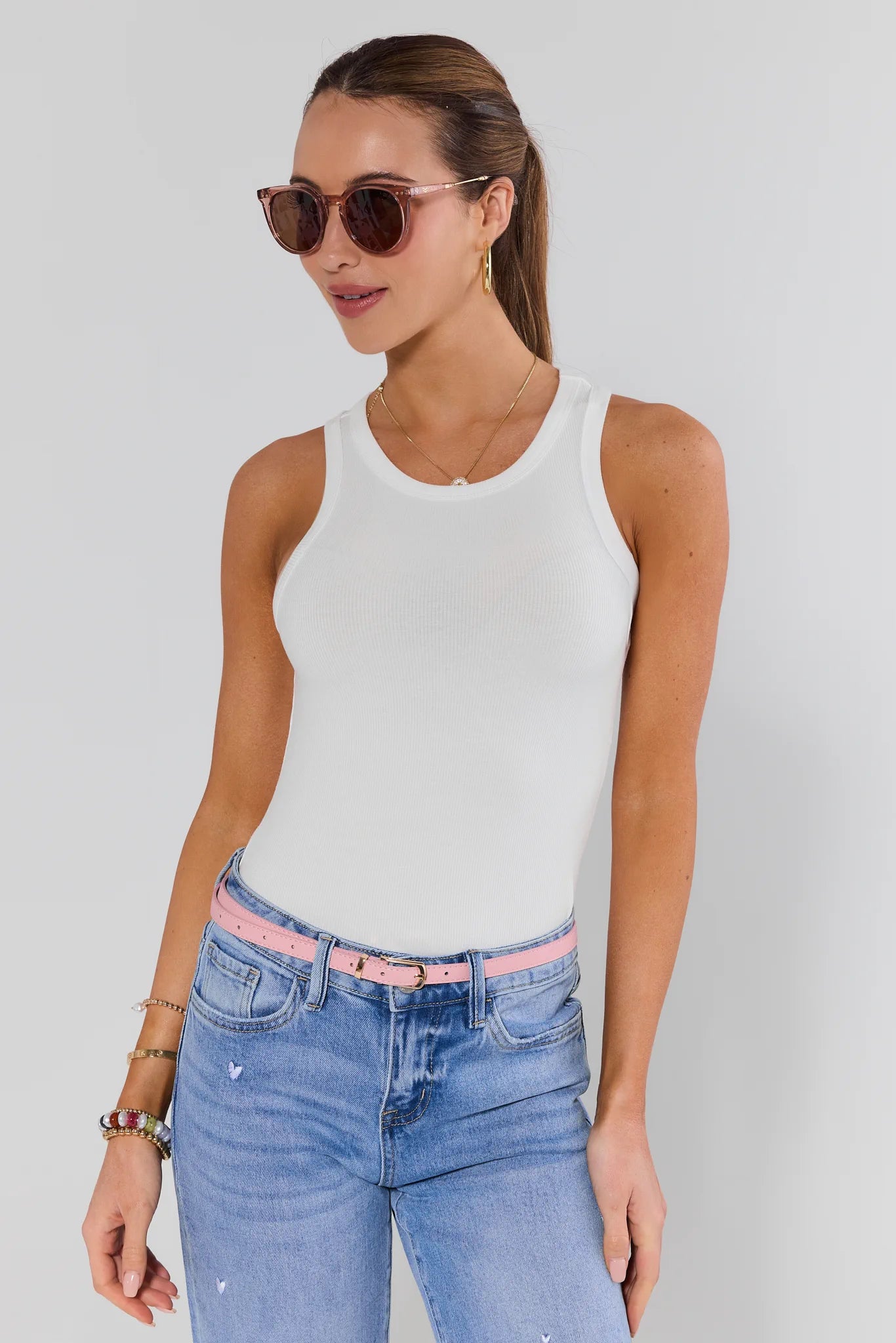 woman wearing Pink Faux Leather Skinny Belt on white background