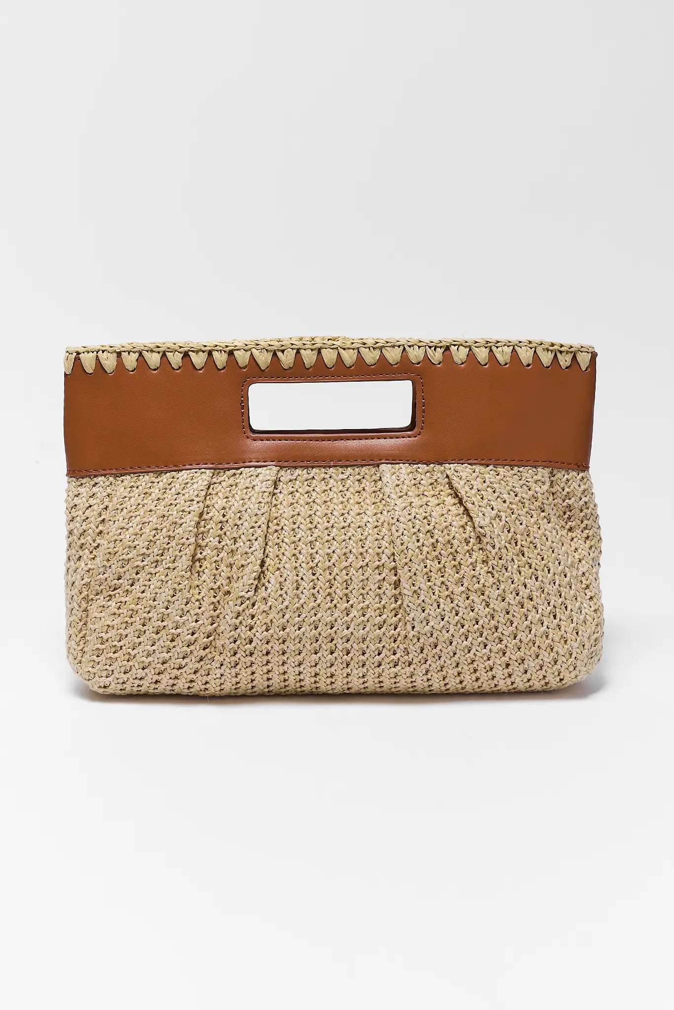 Beige woven handbag with brown leather handle on a white background