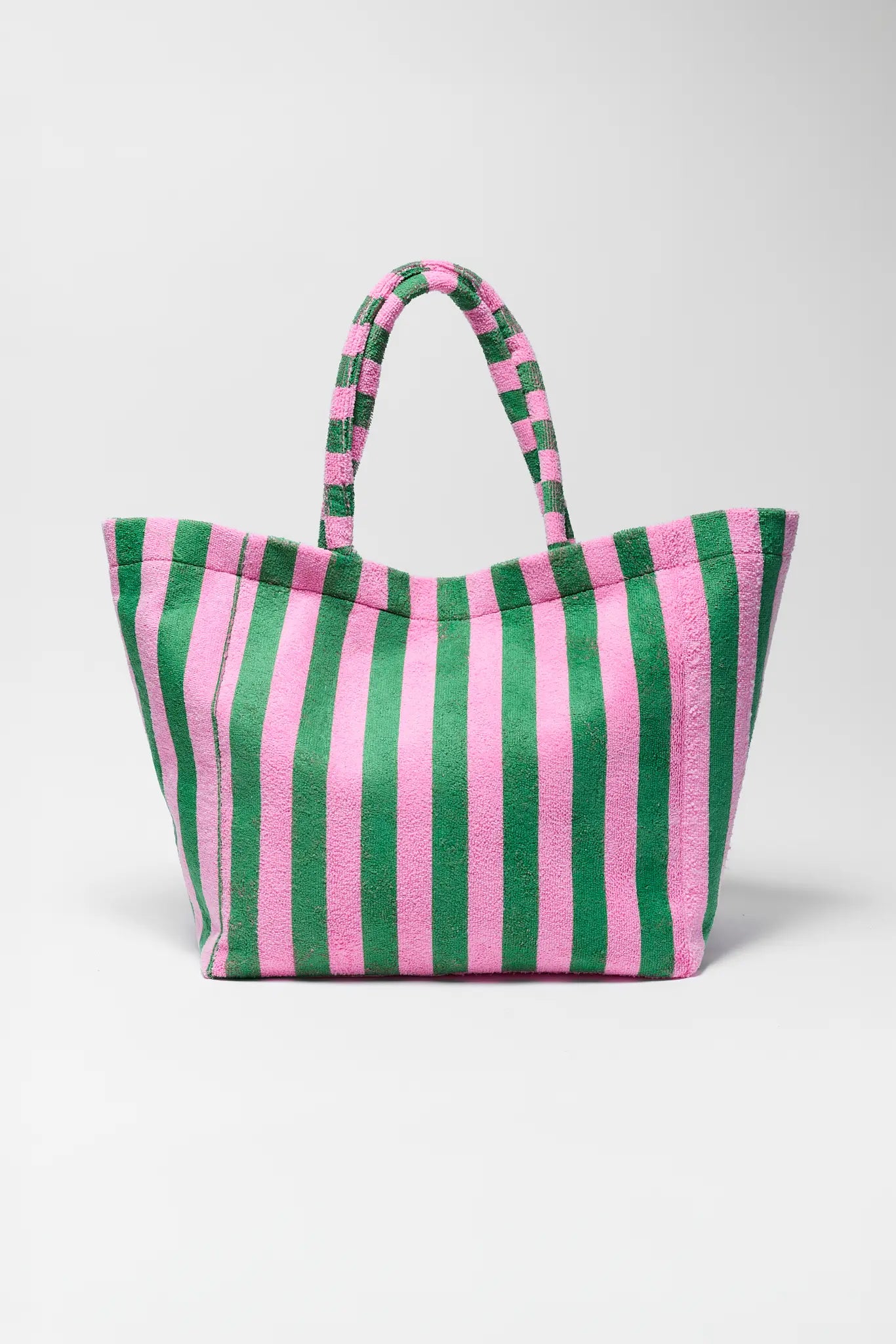 Striped green and pink bag on a white background