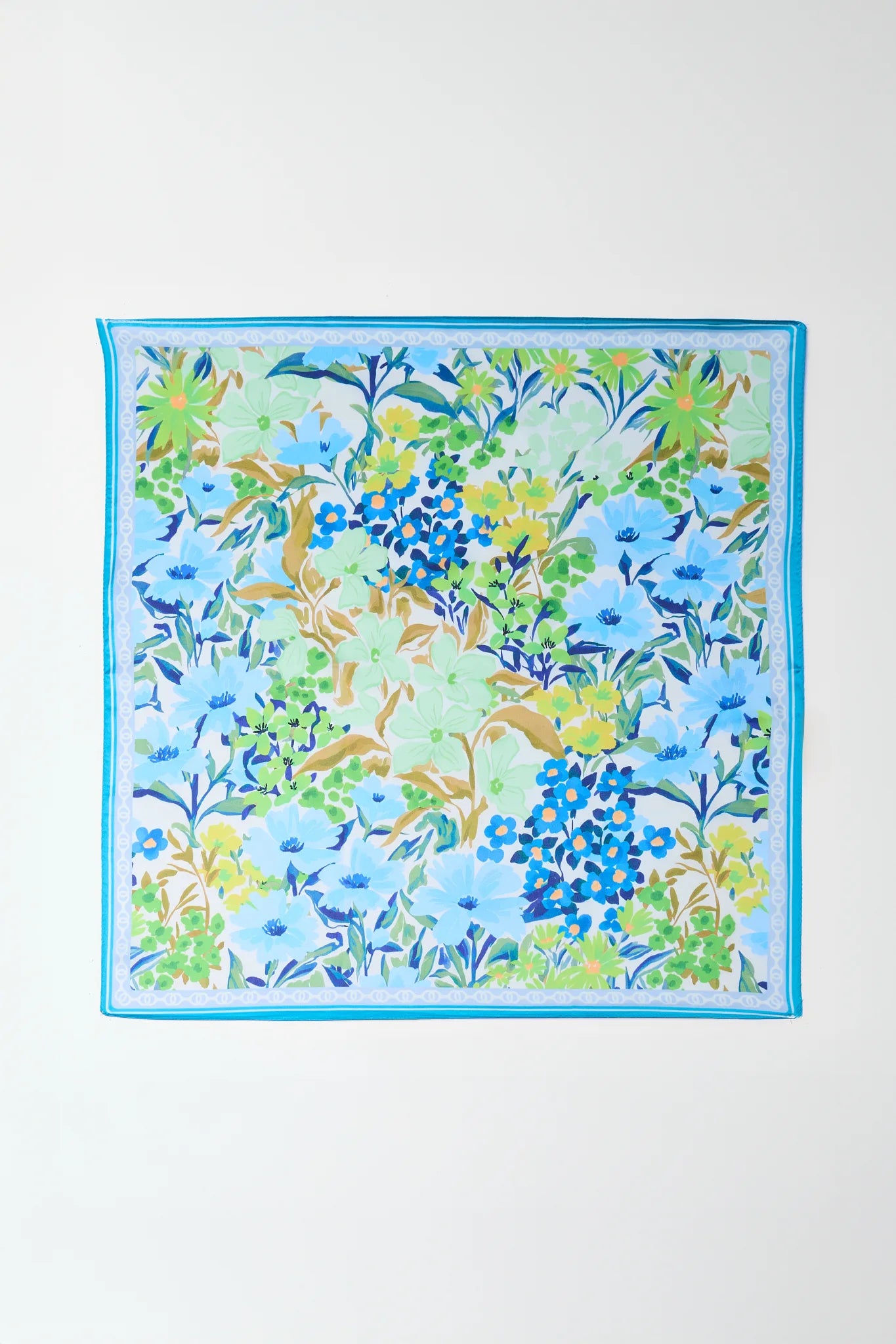 Floral patterned fabric square on a white background