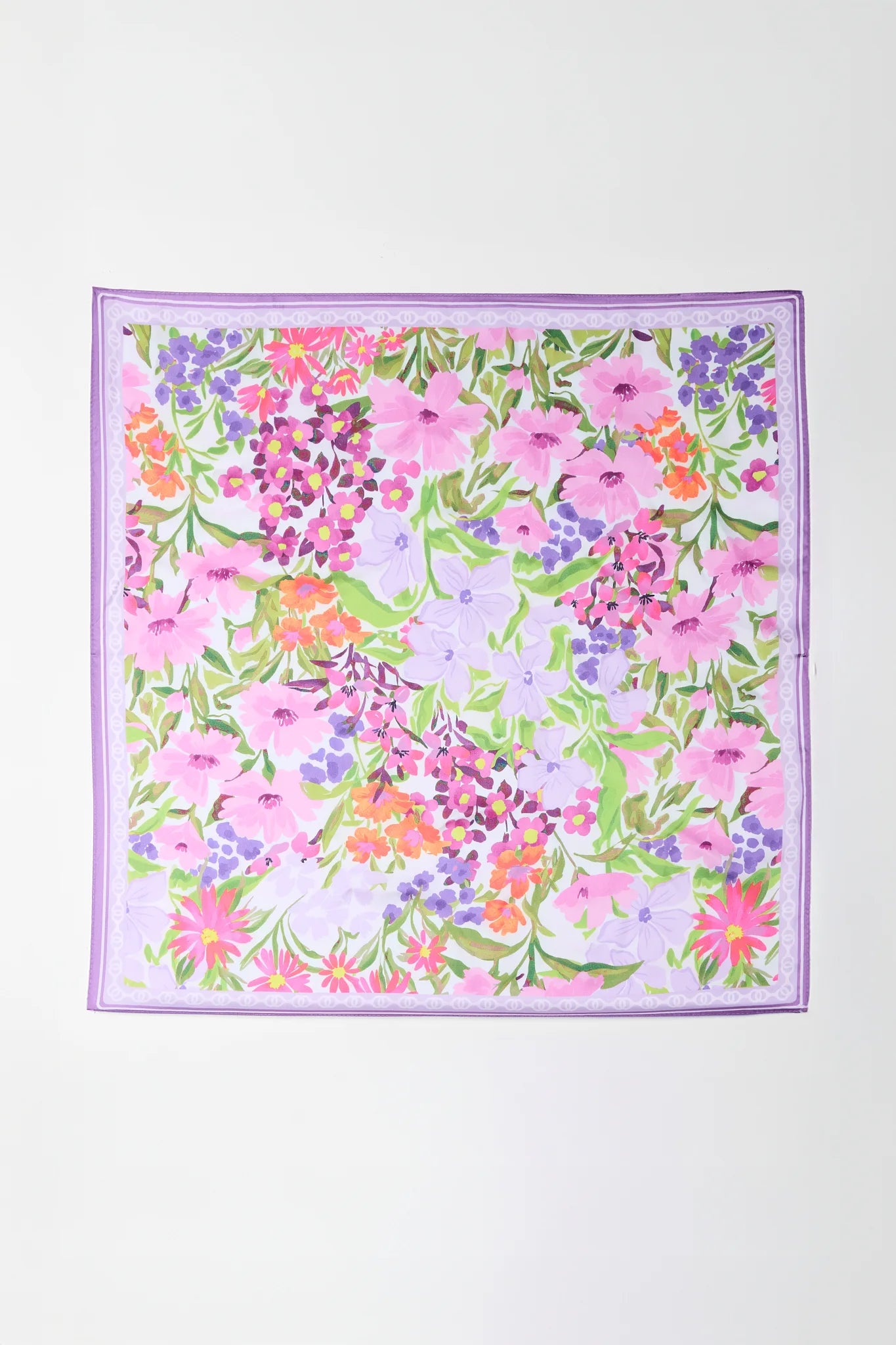 Floral patterned fabric square on a white background