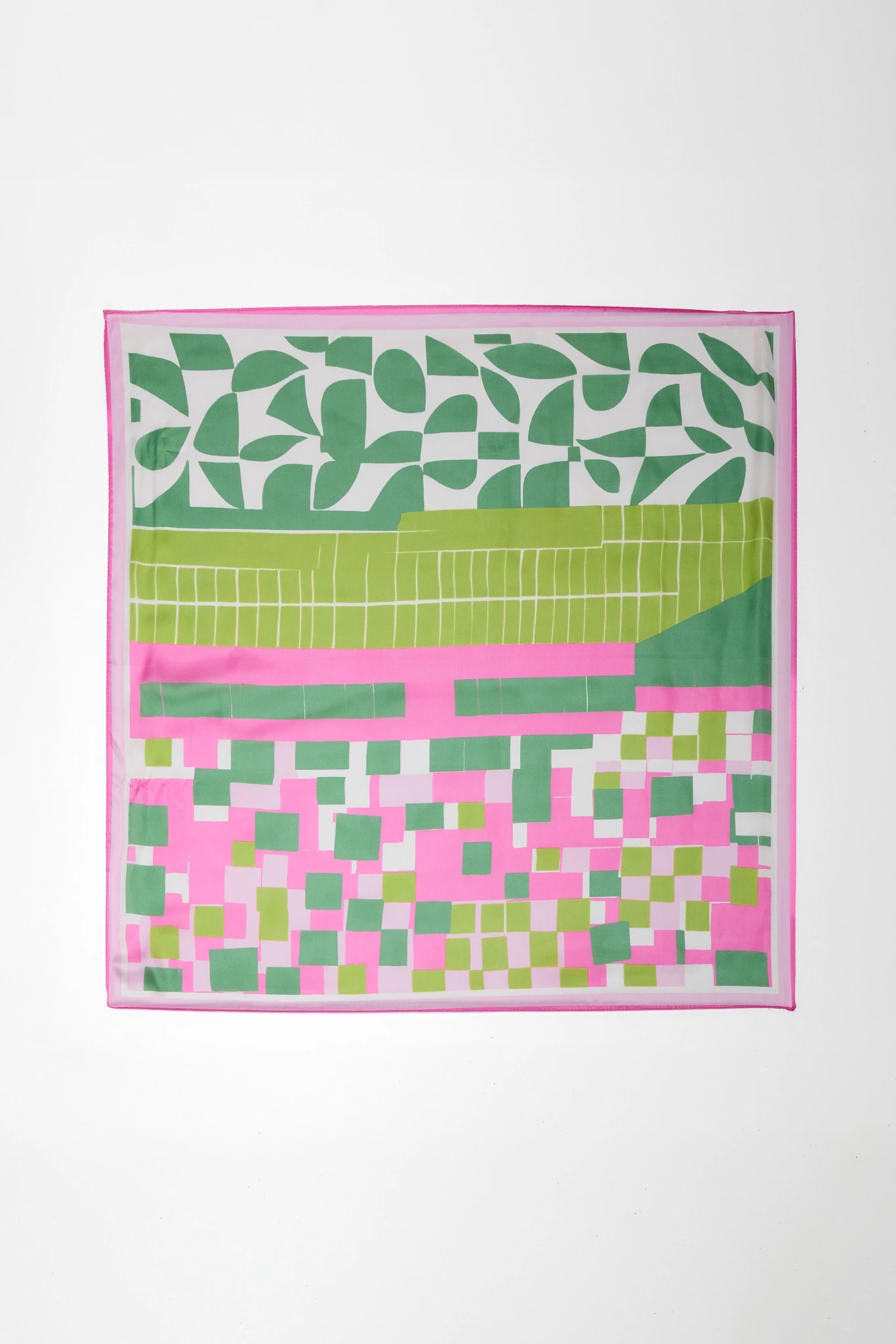 Colorful scarf with geometric and leaf patterns on a white background
