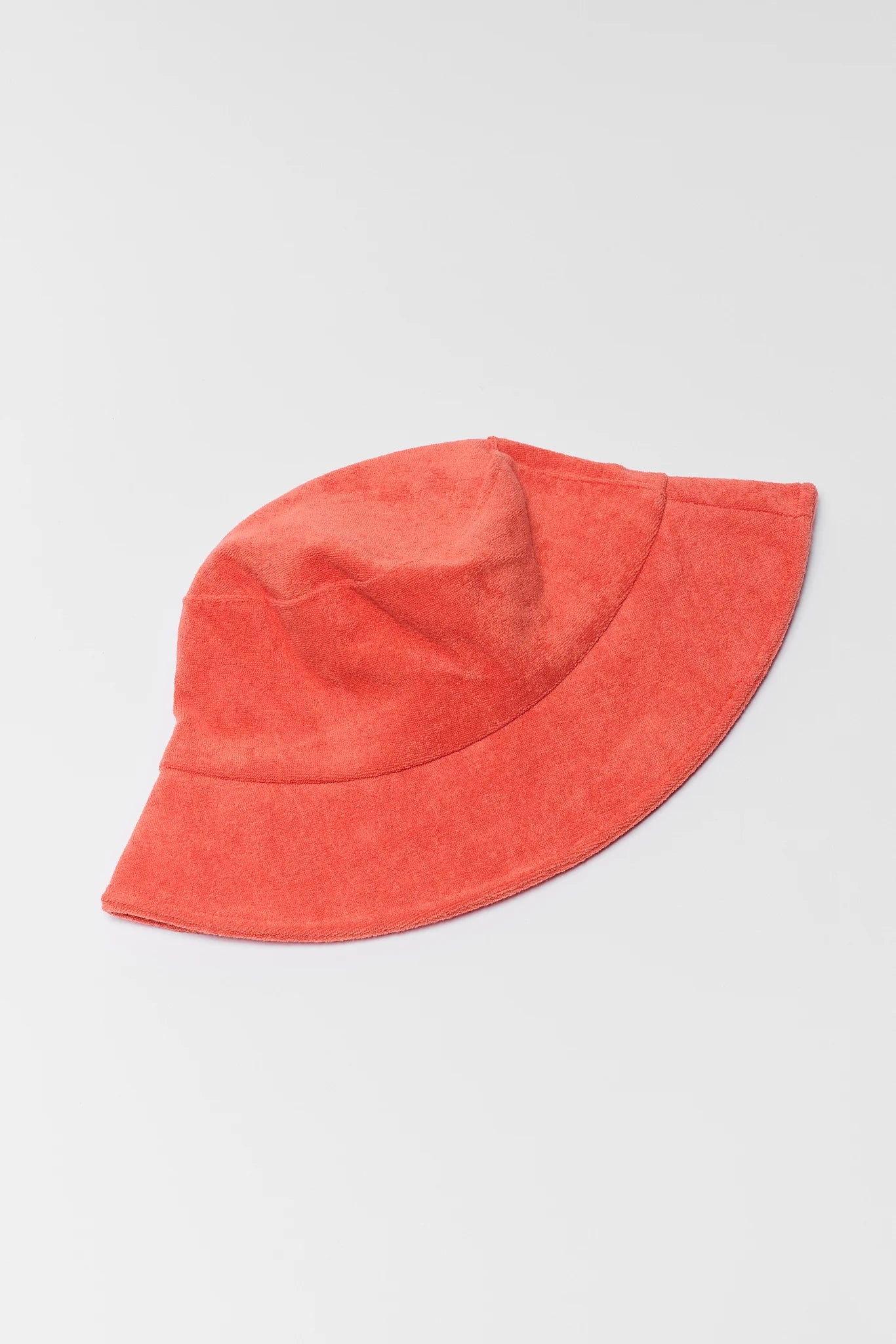 Red bucket hat on a light gray background