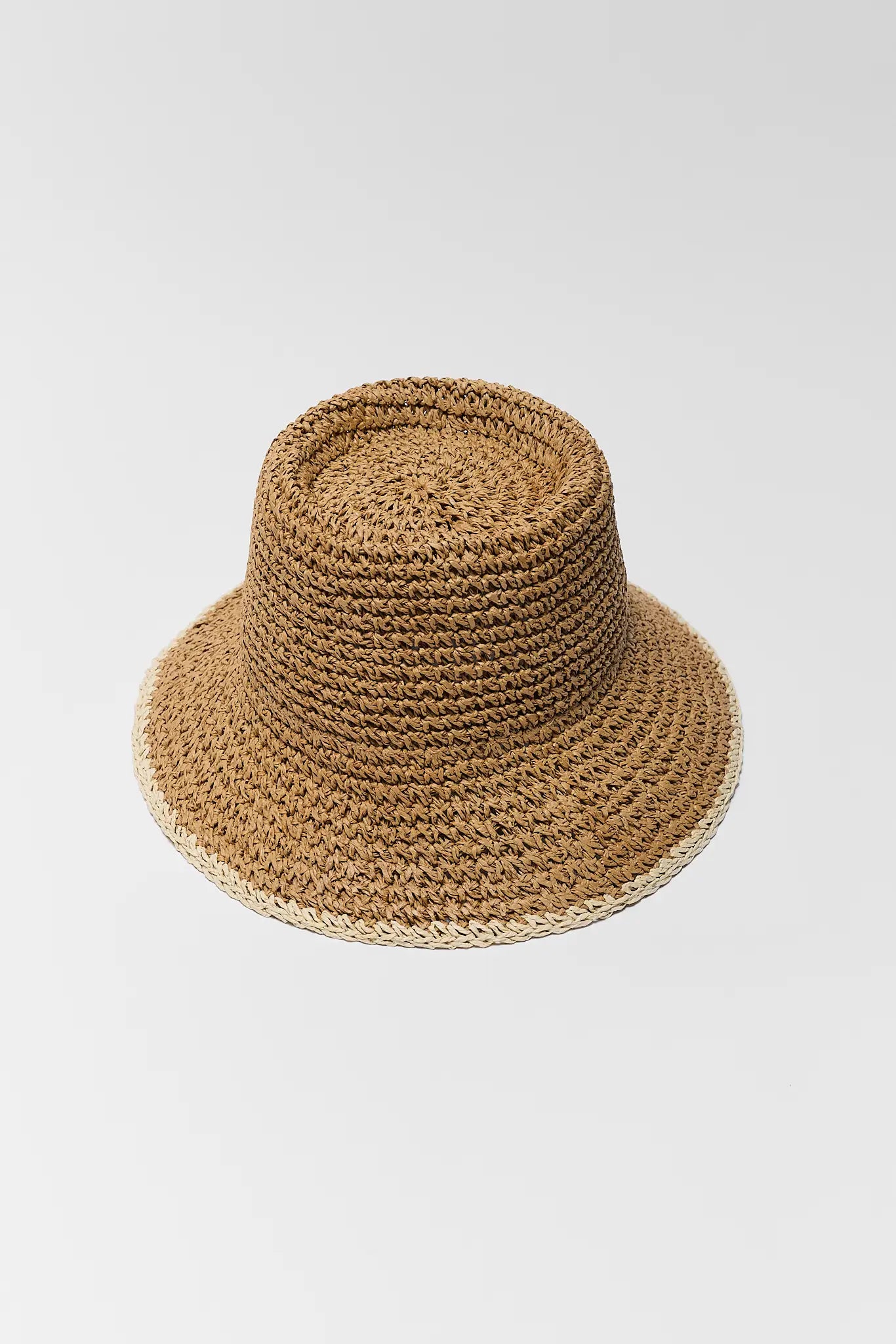 Brown woven hat on a light gray background