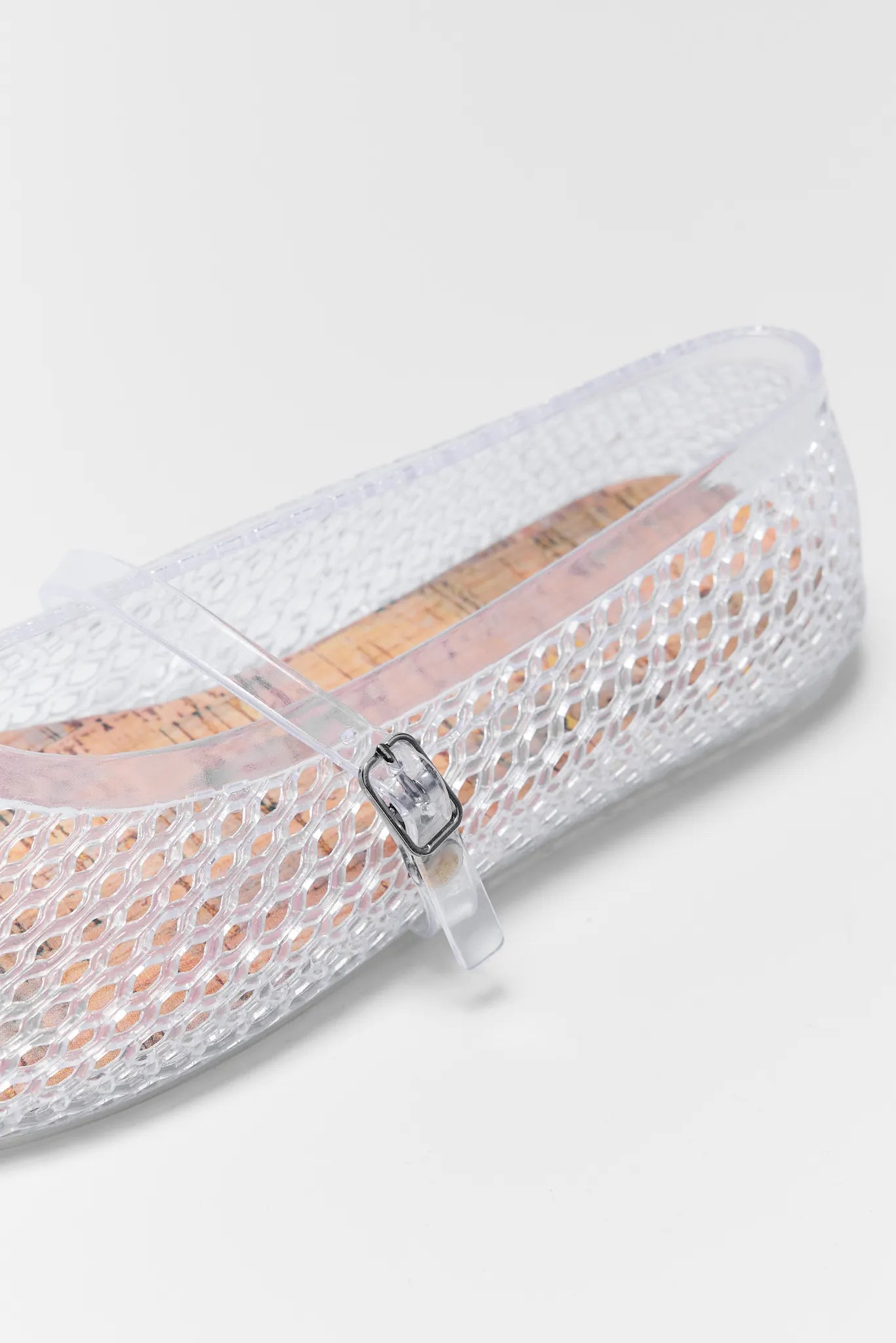 Sally Clear Jelly Flats with a strap on a light gray background