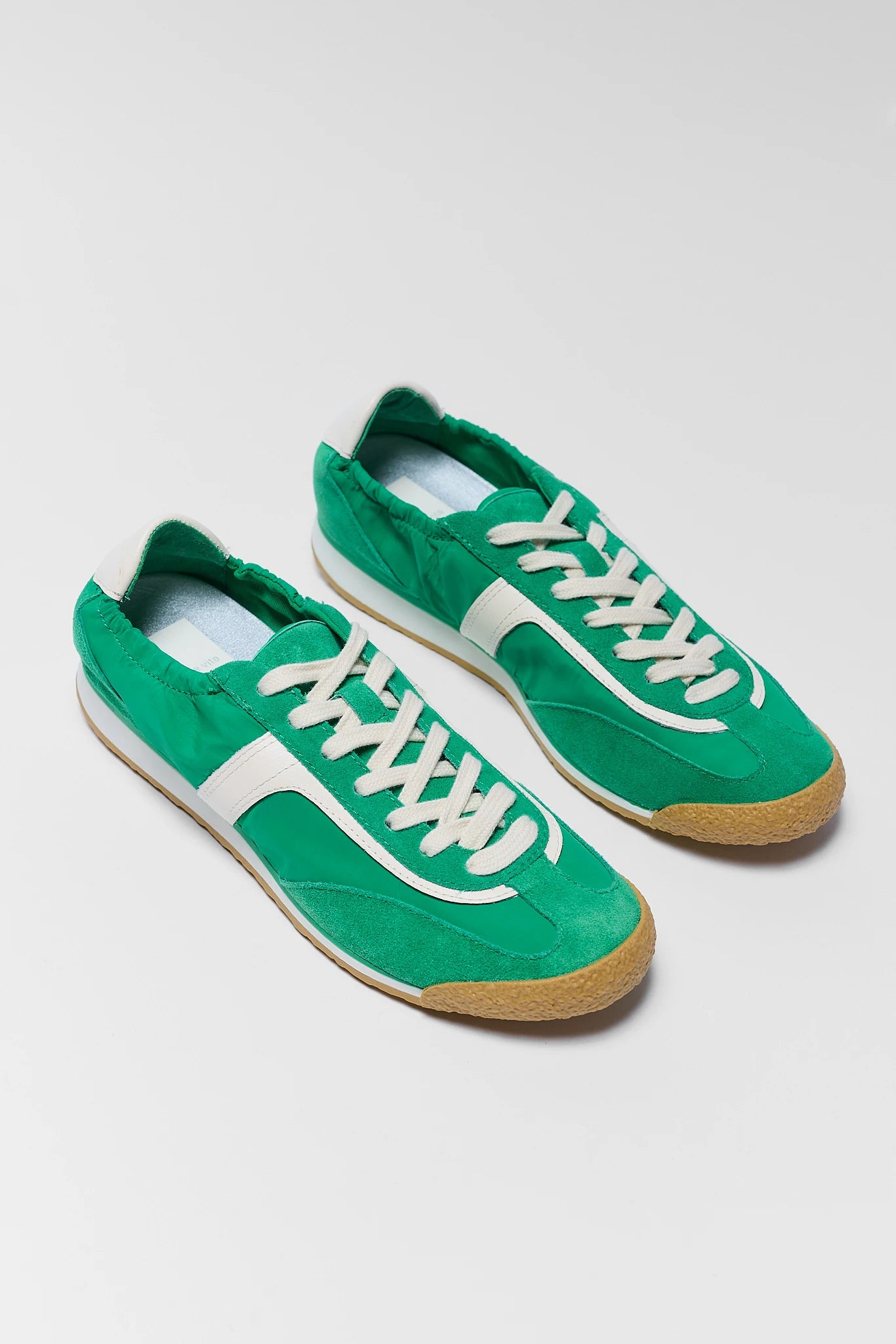 two green Dolce Vita sneakers