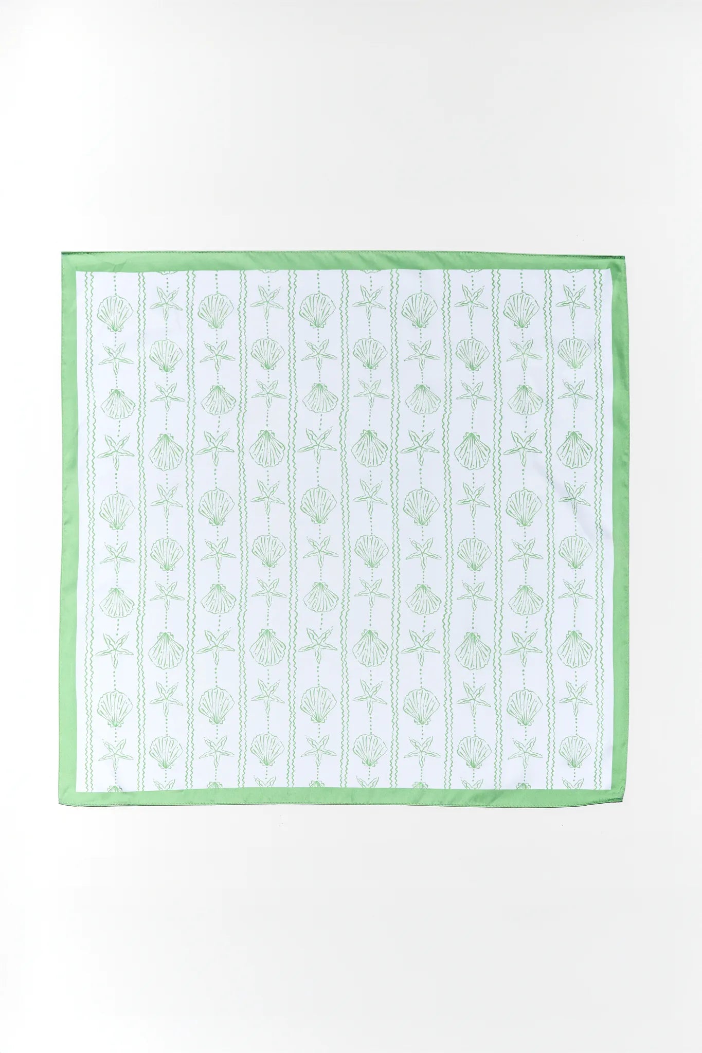 Fabric swatch with green floral pattern on a white background