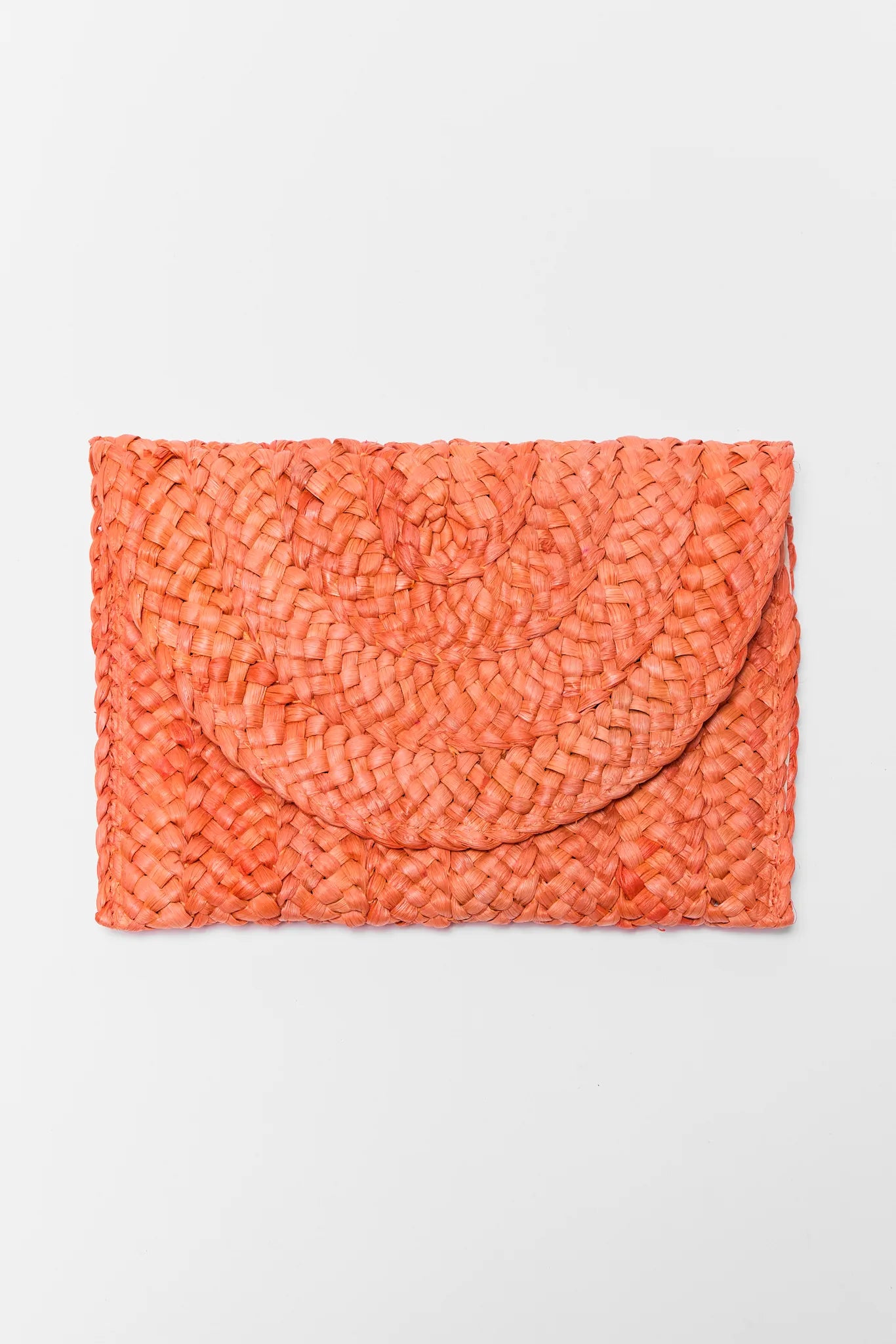 Orange textured clutch bag on a light gray background