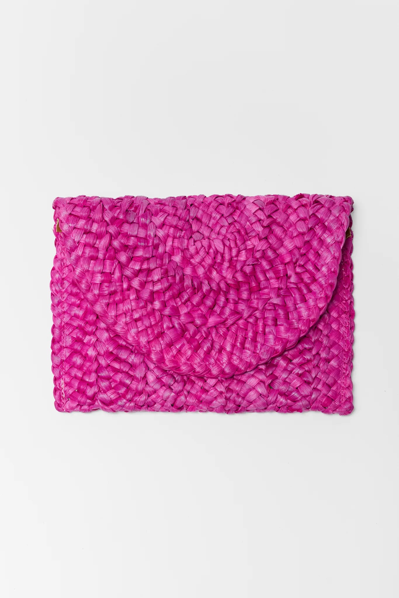 Pink textured clutch bag on a white background