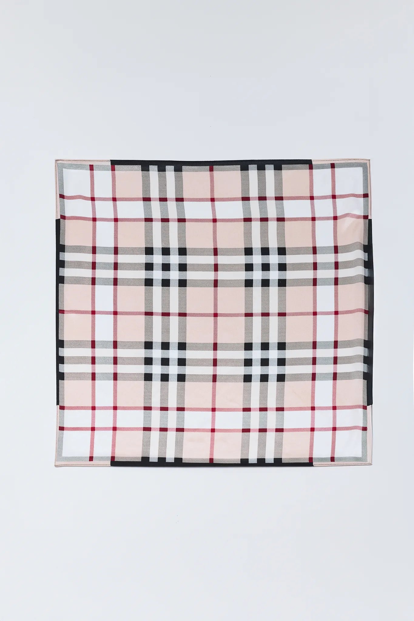 Plaid patterned fabric on a white background