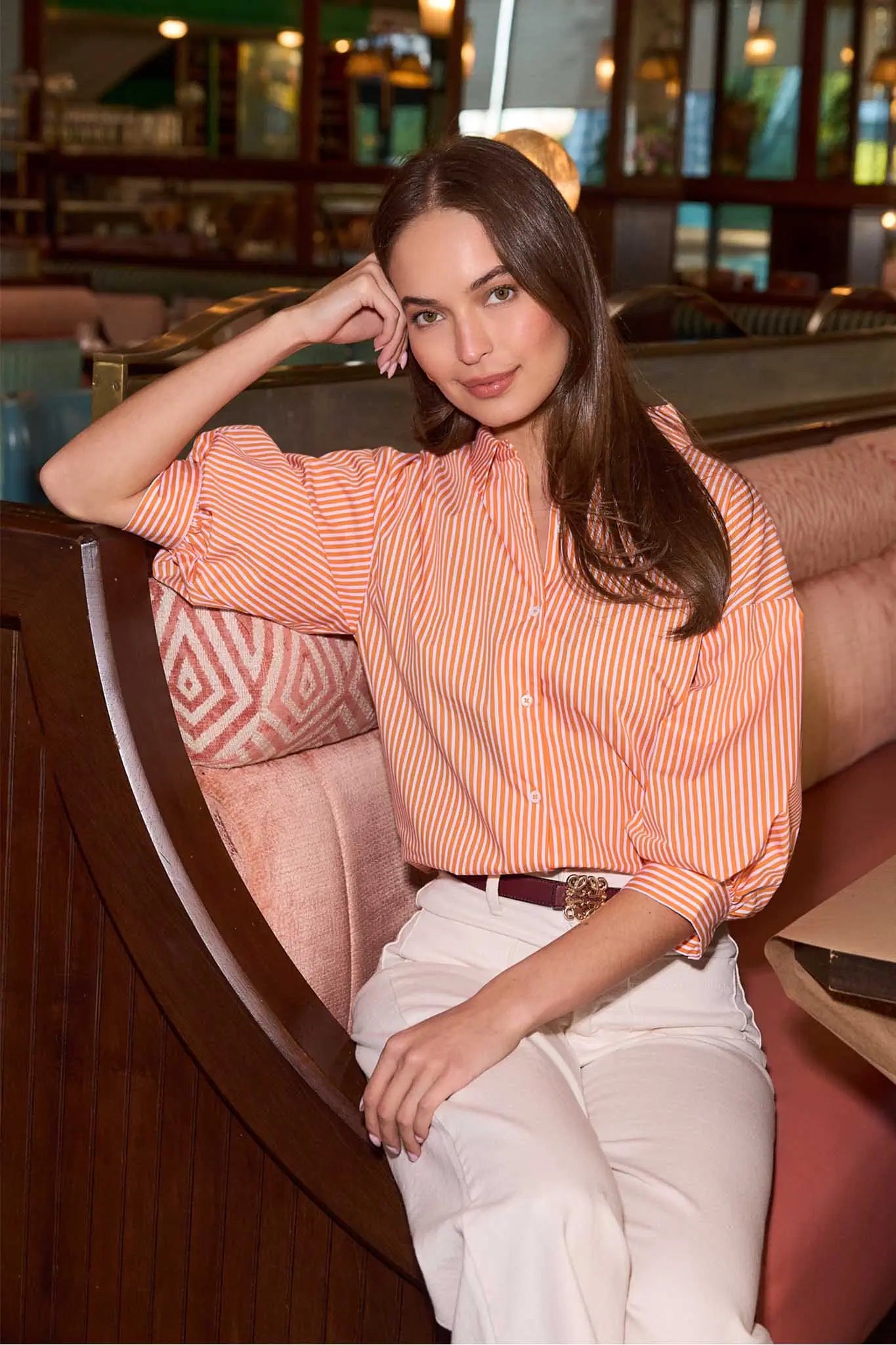 woman wearing pink striped button up