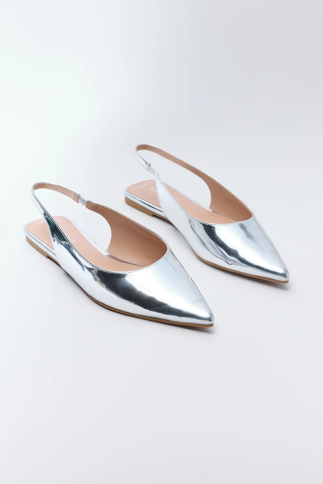 Sylvia Silver Metallic Flats on a white background