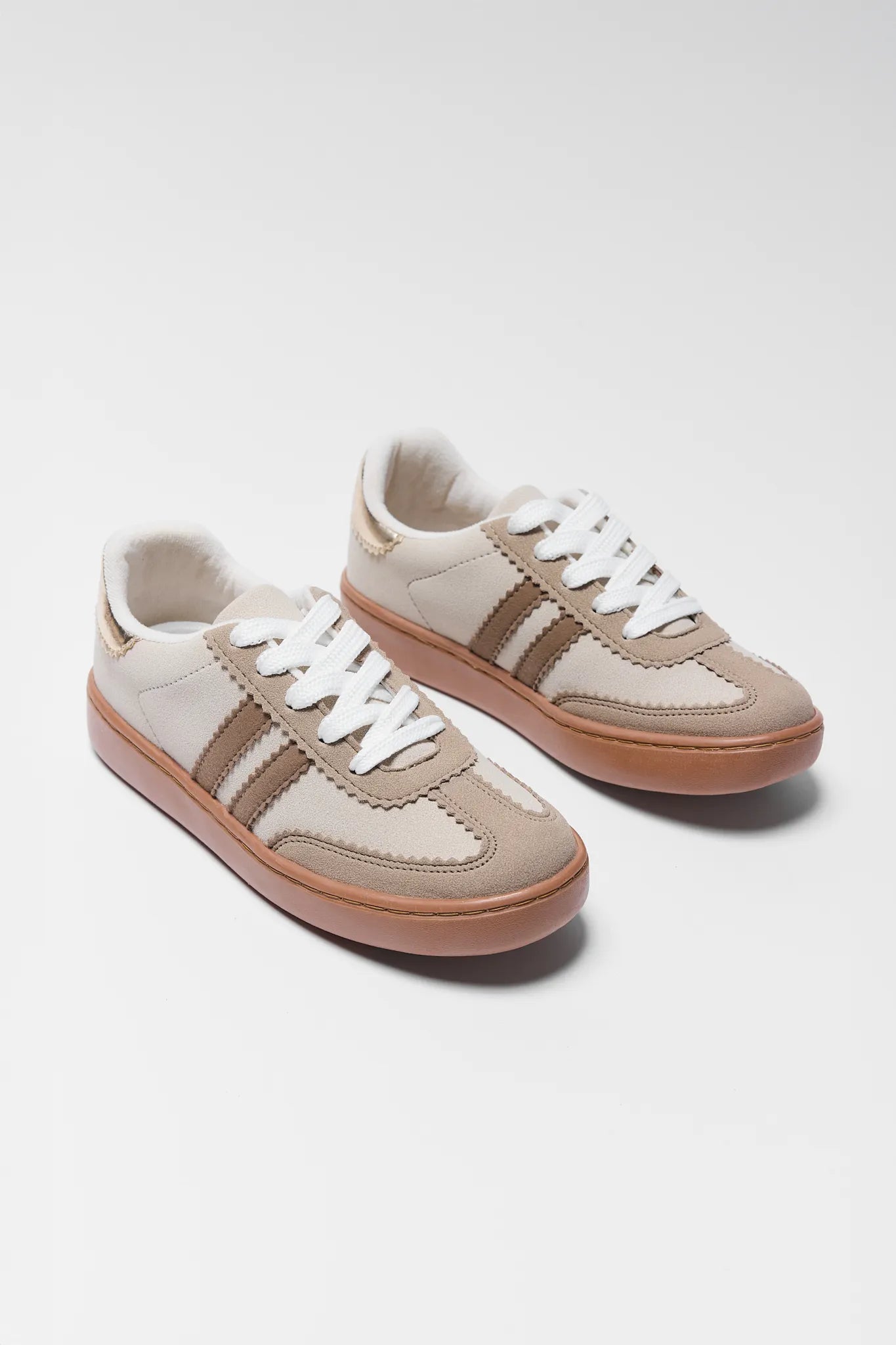 Pair of Sylvie Tan Striped Sneakers on a white background