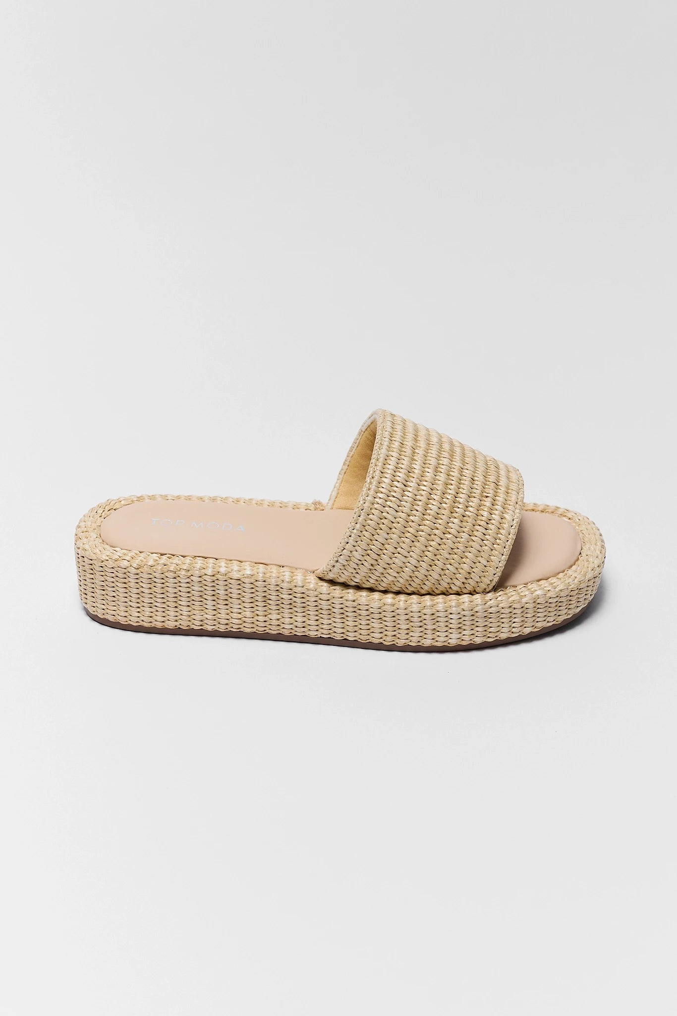 one Beige woven sandal on a light gray background