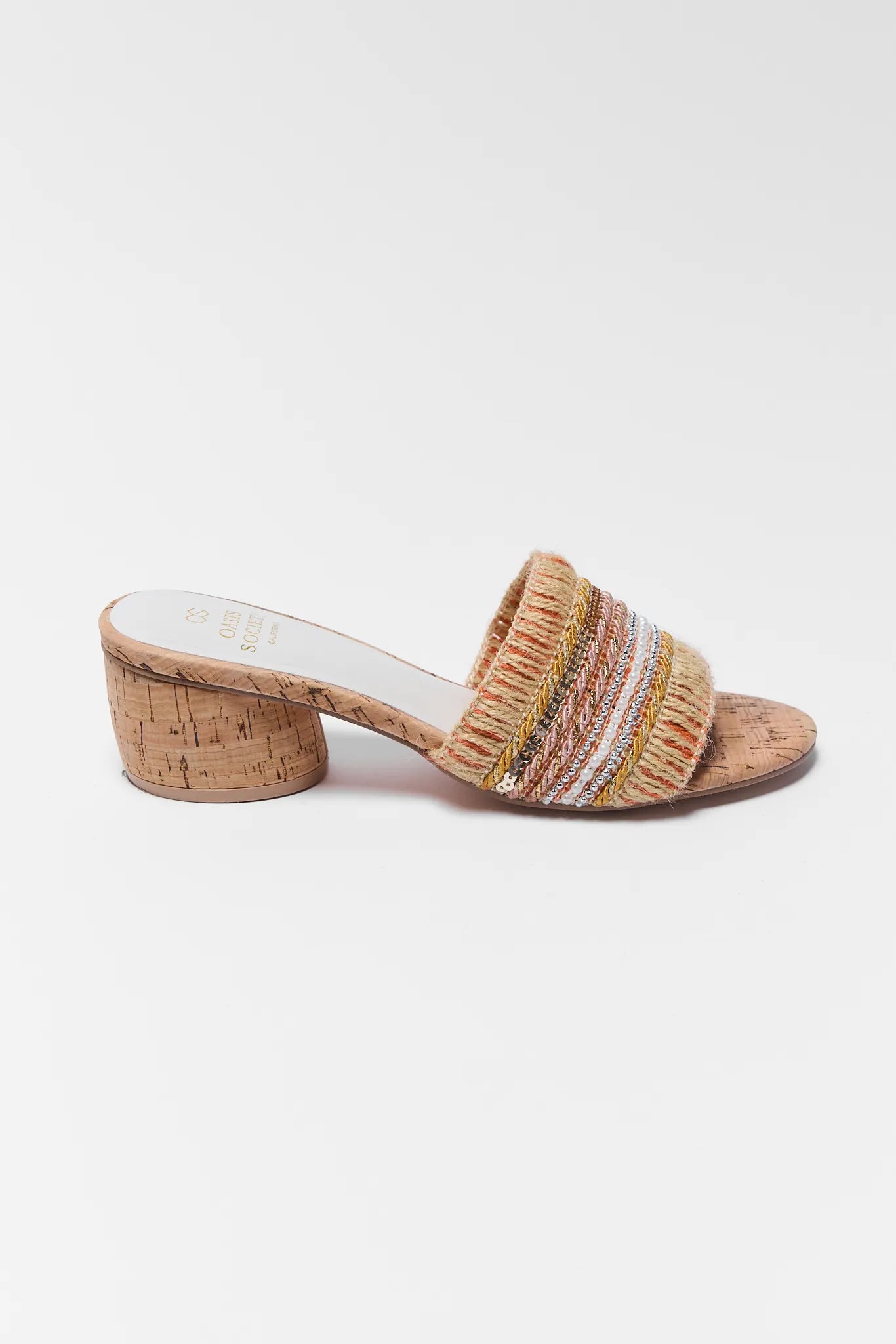 Woven sandal with cork sole on a white background