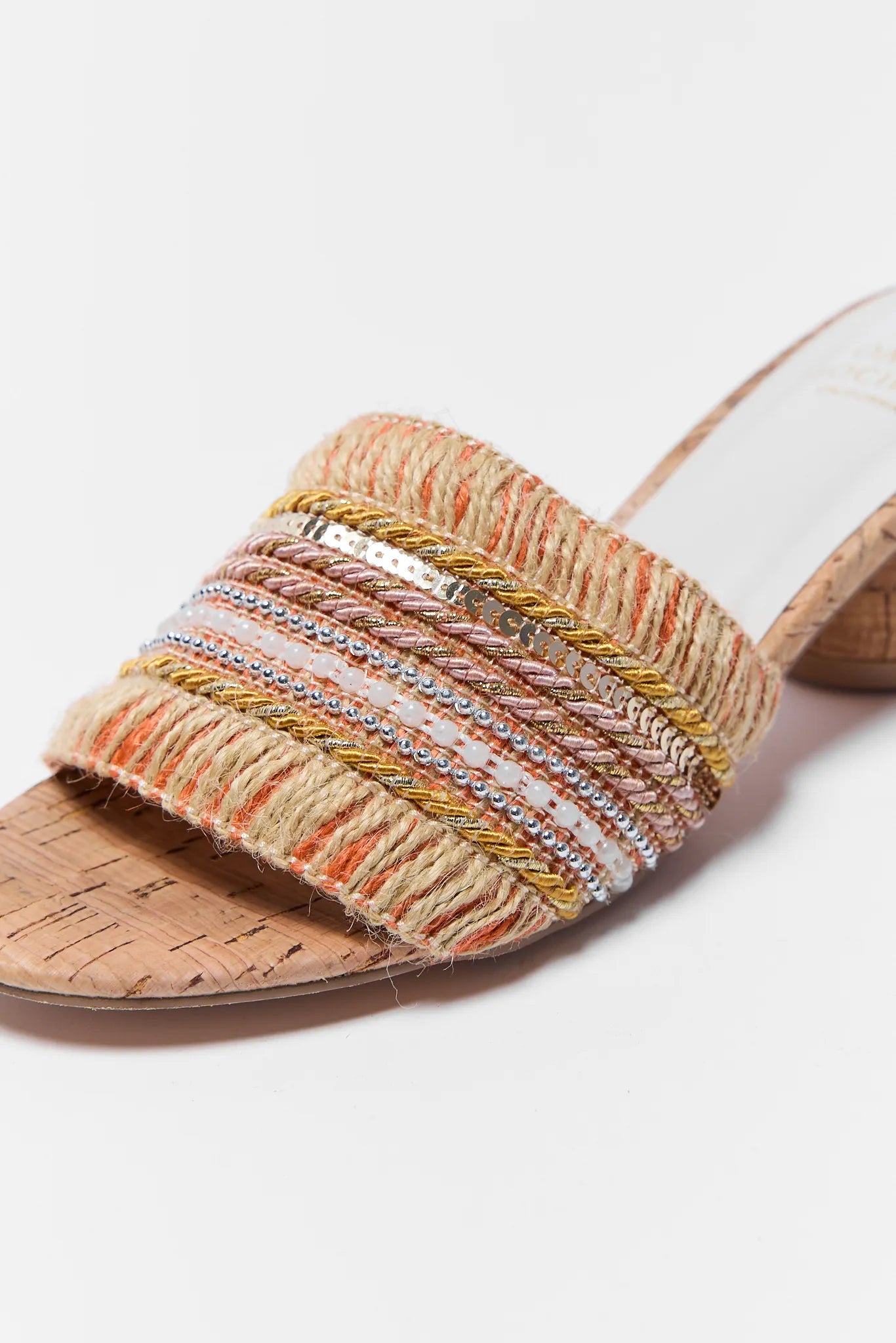 Multicolored woven sandal on a white background