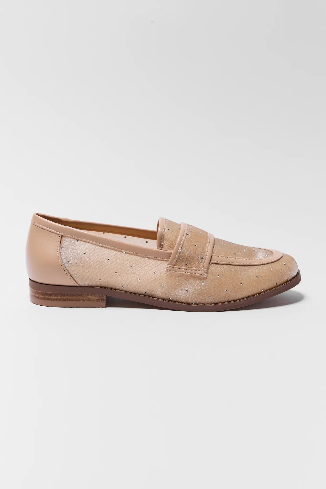 Beige loafer shoe on a light gray background