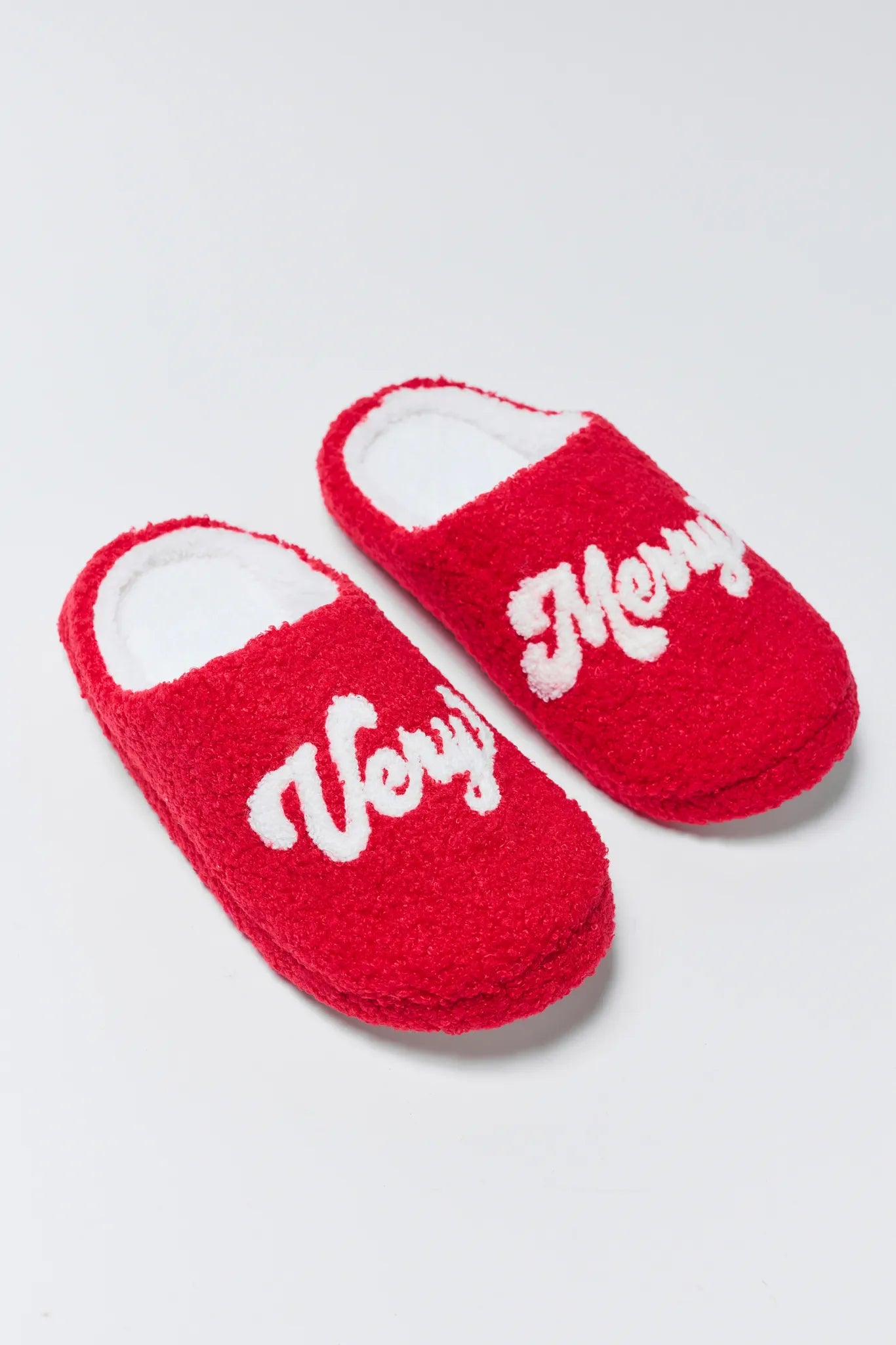 Very Merry Fuzzy Slippers on a white background