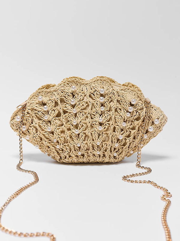 Beige woven handbag with pearl embellishments on a light gray background updated