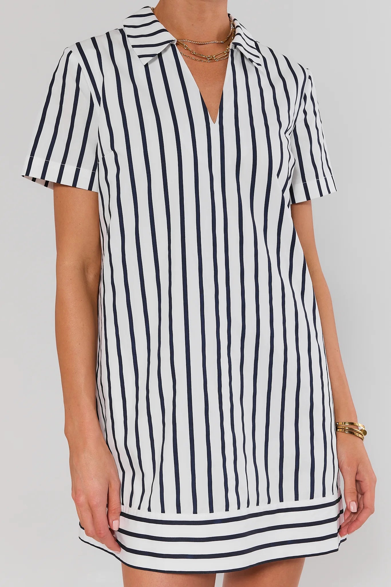 close up Black and white striped dress on a plain background