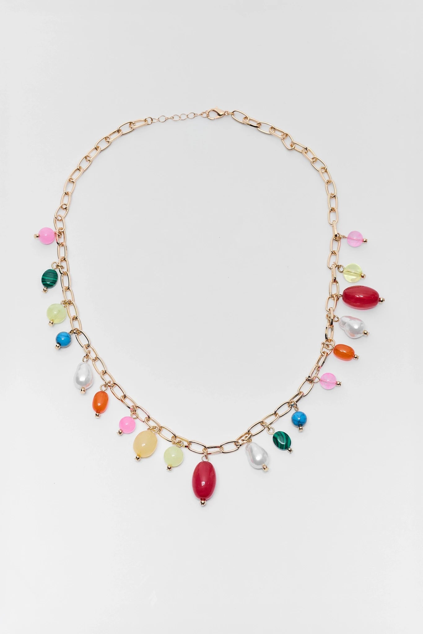 Necklace with colorful beads on a light gray background