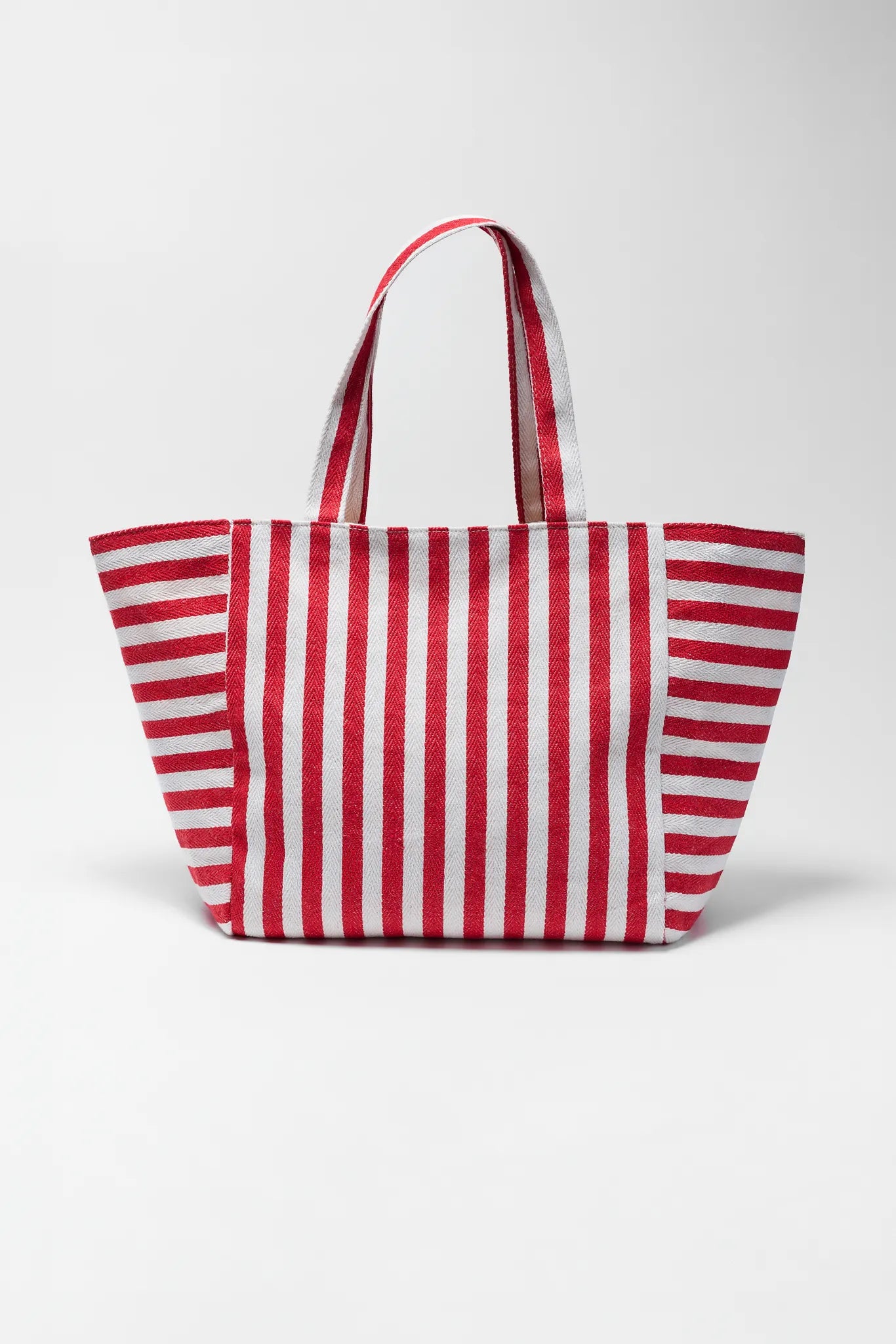 Red and white striped tote bag on a white background