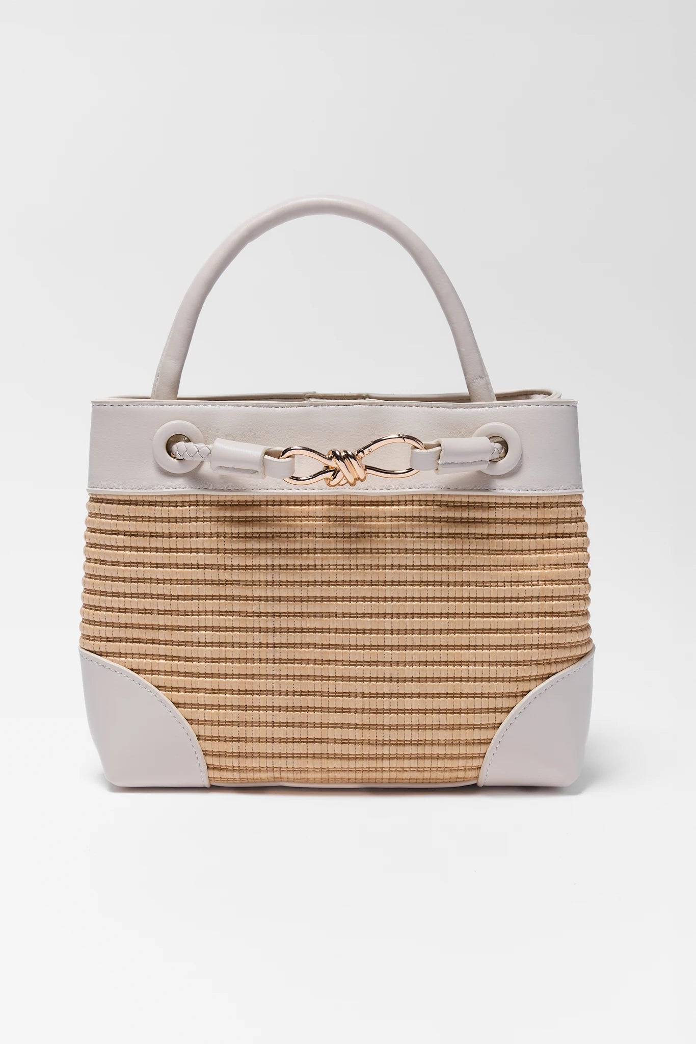 Handbag with beige woven top and white base on a white background