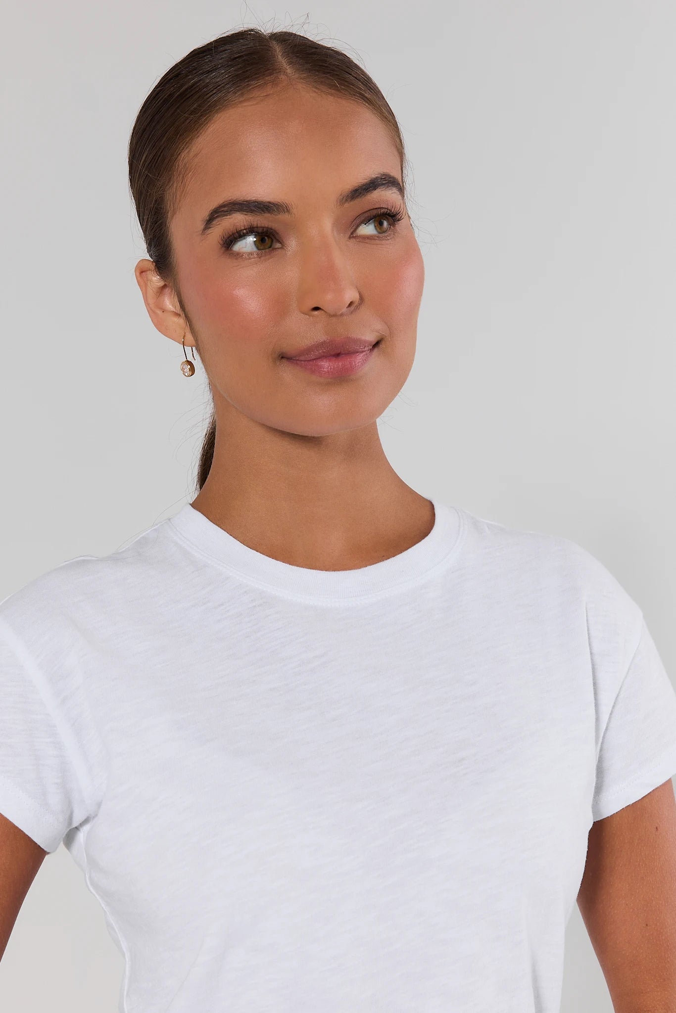 close up woman wearing white modern slub tee on a white background