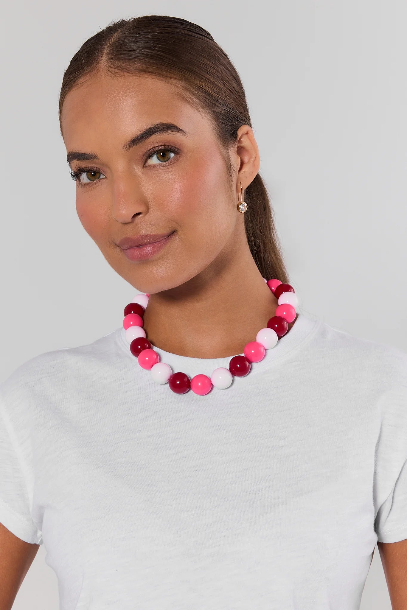 Woman wearing Pink Multi Chunky Beaded Necklace on a white background