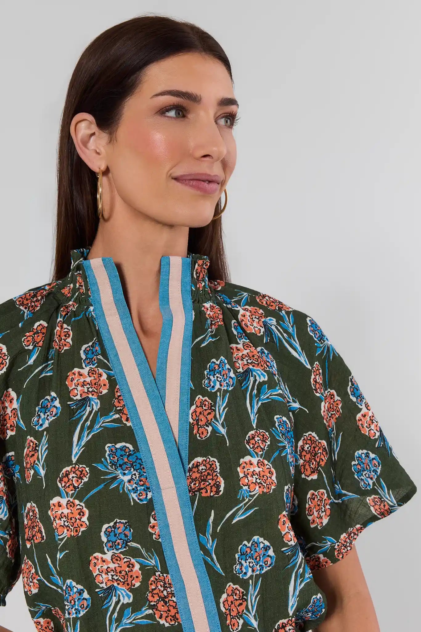 close up Woman wearing Macey Forest Green Floral Top by THML on a white background