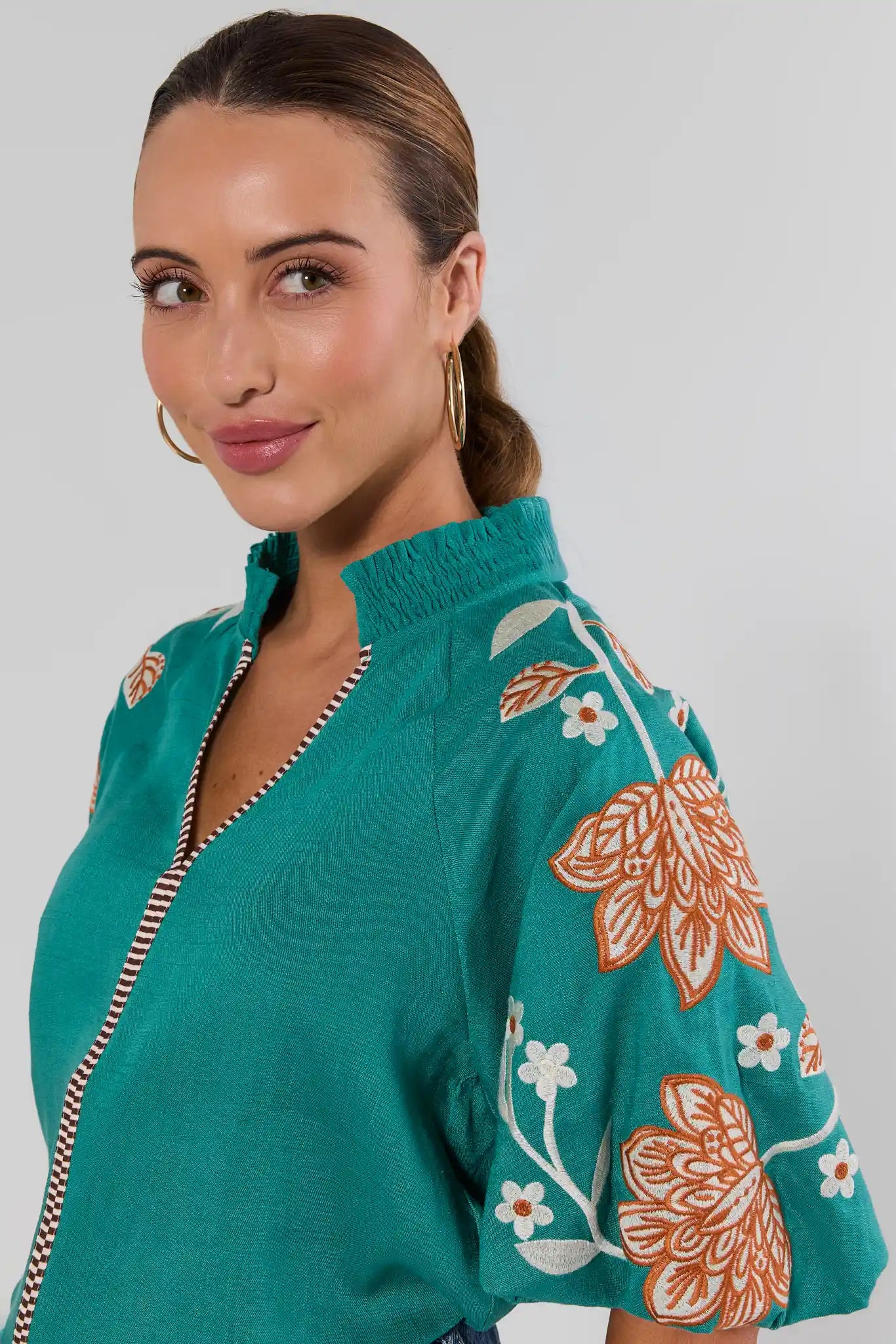 close up Woman wearing Emmett Green Floral Embroidered Top by THML on a white background