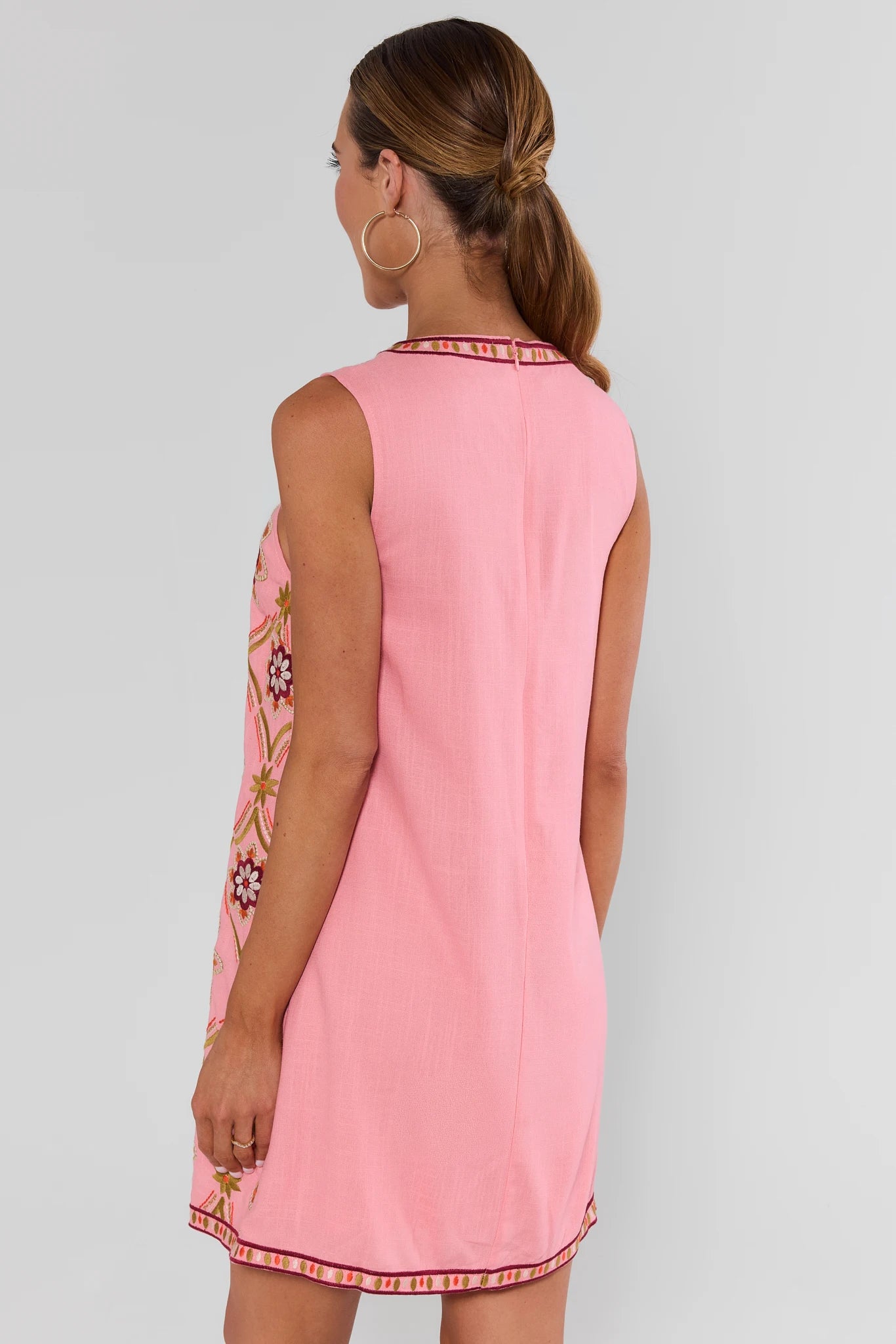 Woman wearing Pink Embroidered Shift Dress by THML on a white background turned