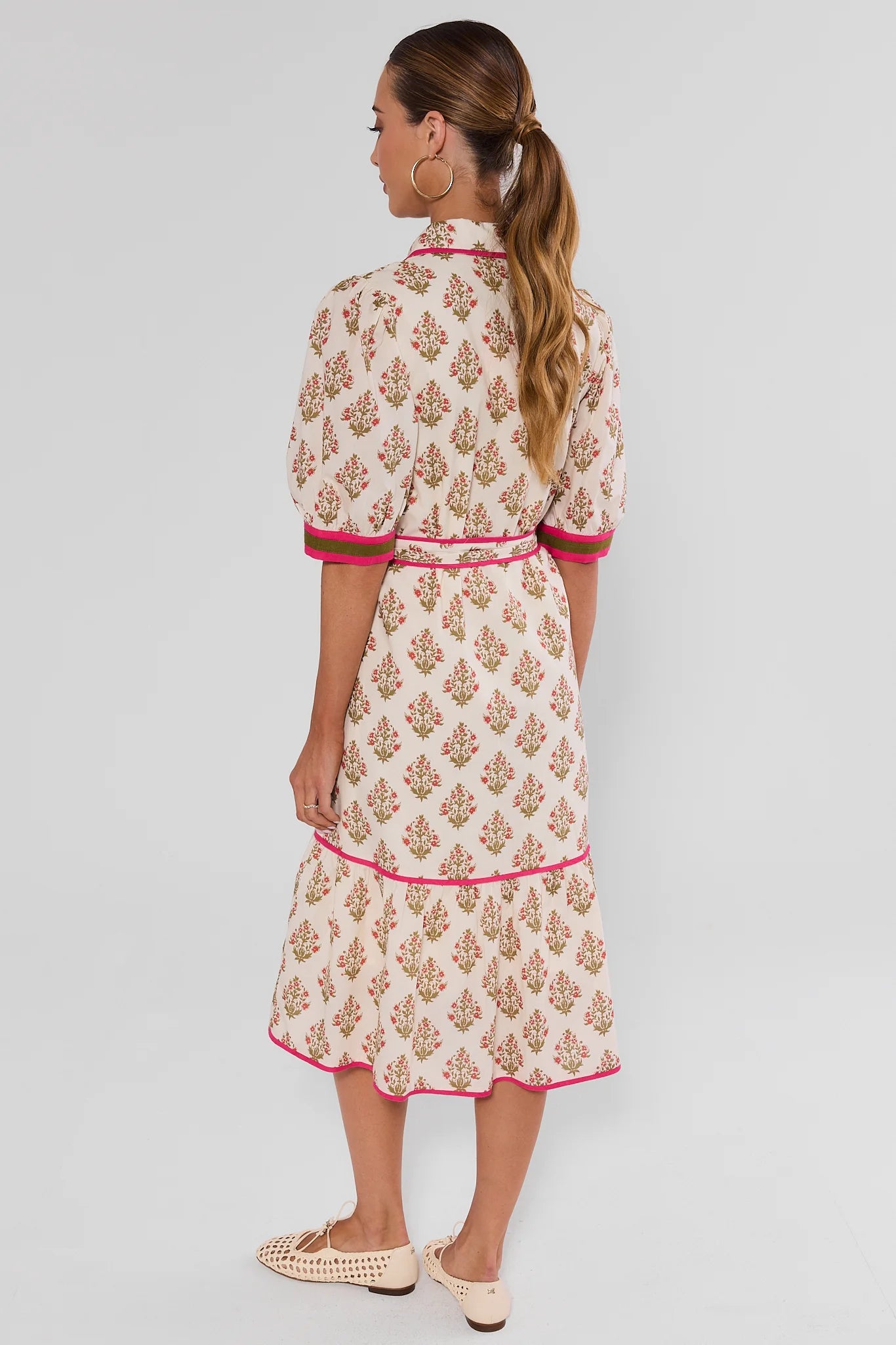 Woman wearing White Floral Button Up Midi Dress by THML on white background turned