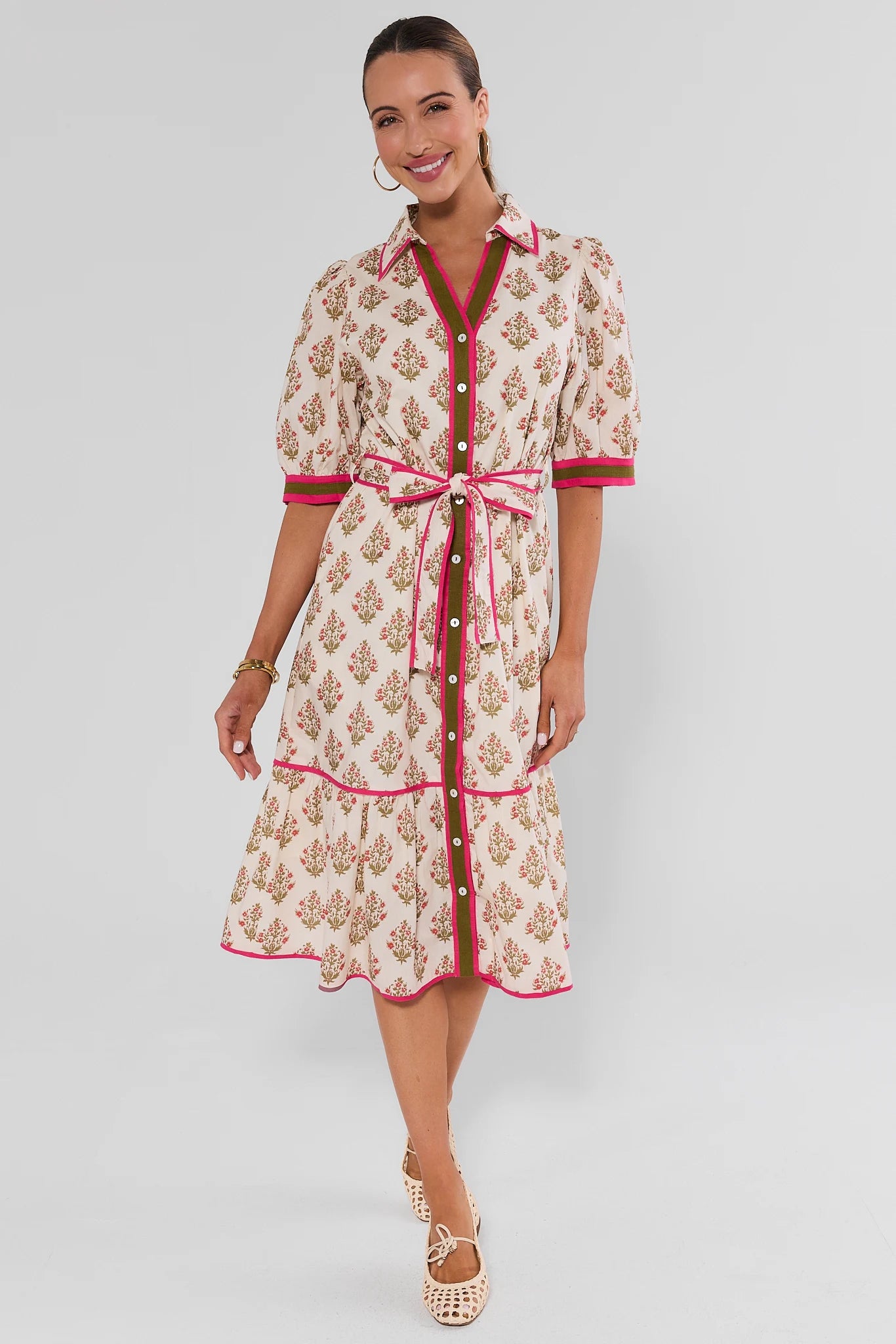 Woman wearing White Floral Button Up Midi Dress by THML on white background walking