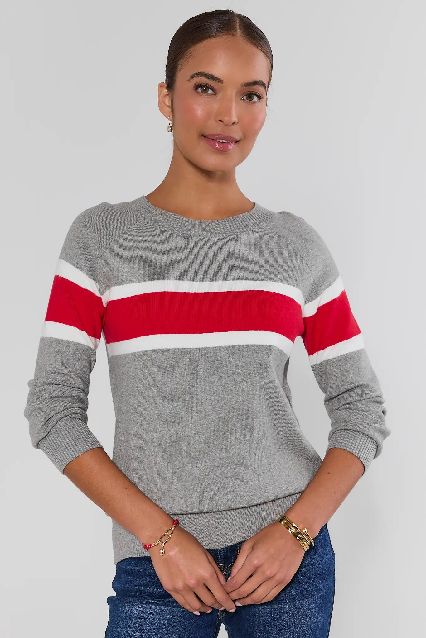 Woman wearing Dylan Red Stripe Sweater on a white background