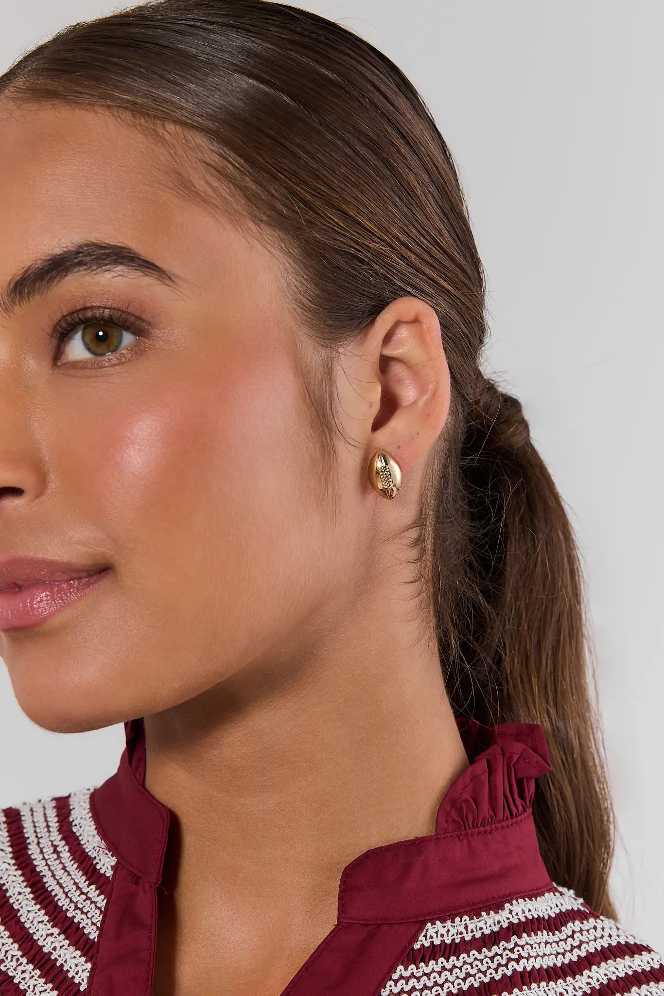Gold Football Stud Earrings on model