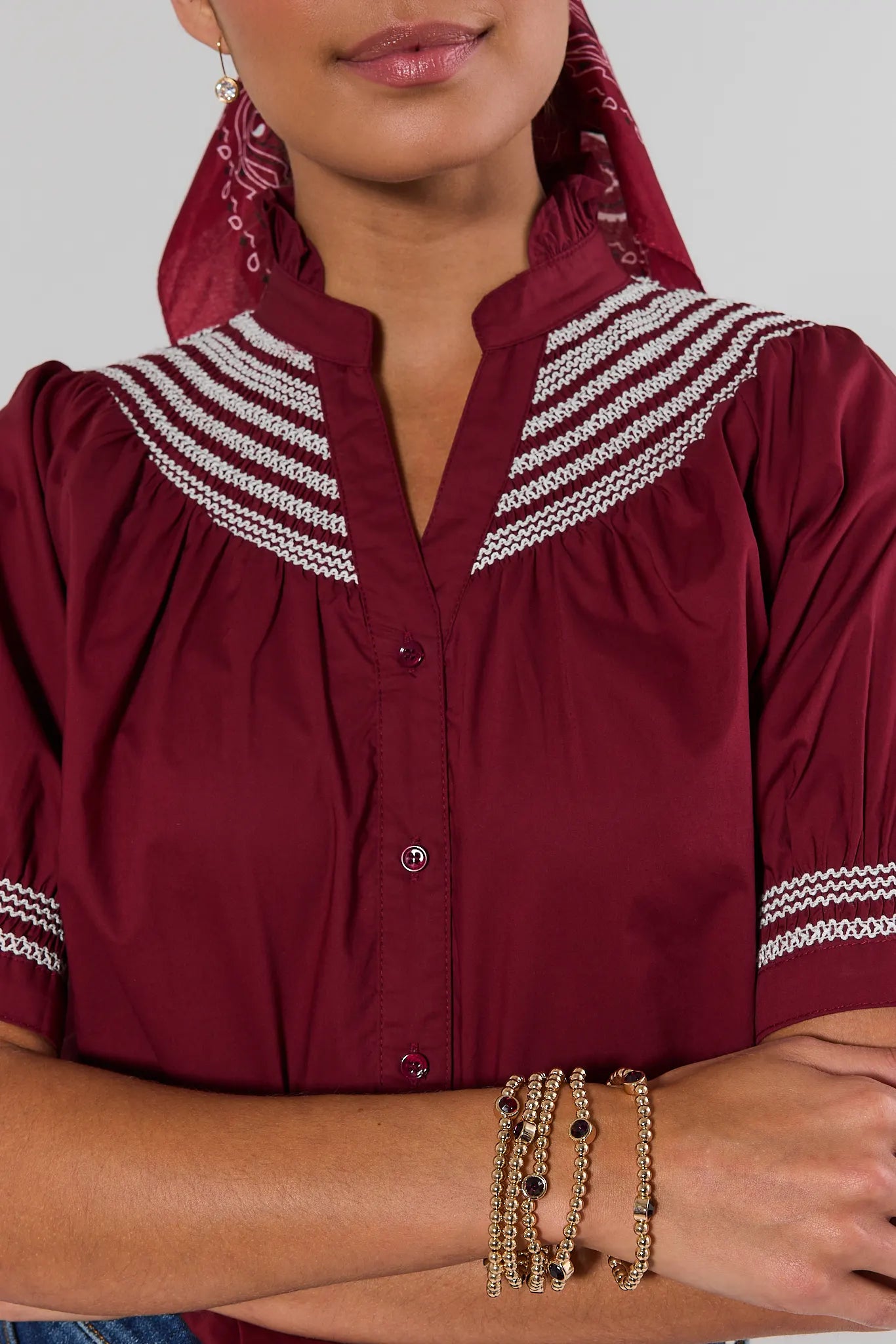 woman wearing Gold Beaded Maroon Rhinestone Bracelet set on a white background