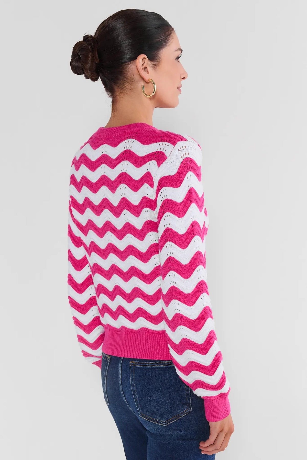 Pink & White Chevron Knit Sweater - Back View On Model with Dark Wash Jeans | Avara