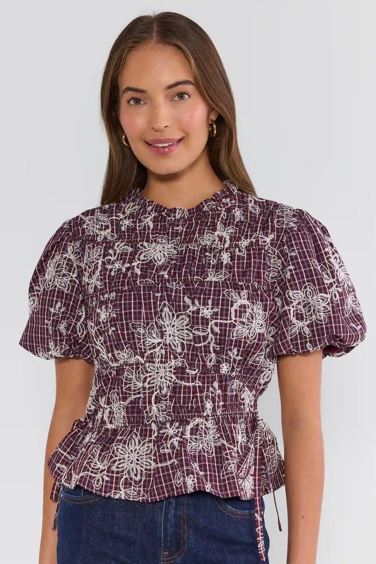 Maroon Floral Smocked Peplum Top - Front View On Model with Dark Wash Jeans | Avara