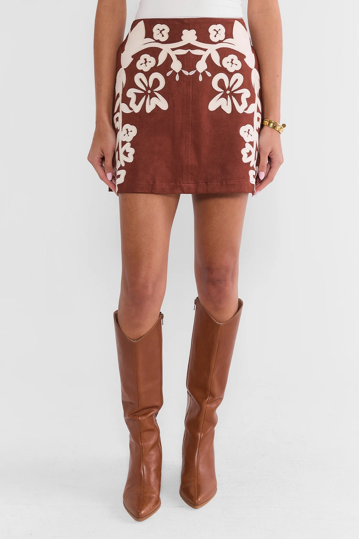 Brown Faux Suede Mini Skirt - Front View with Tall Boots, Styled Look | Avara
